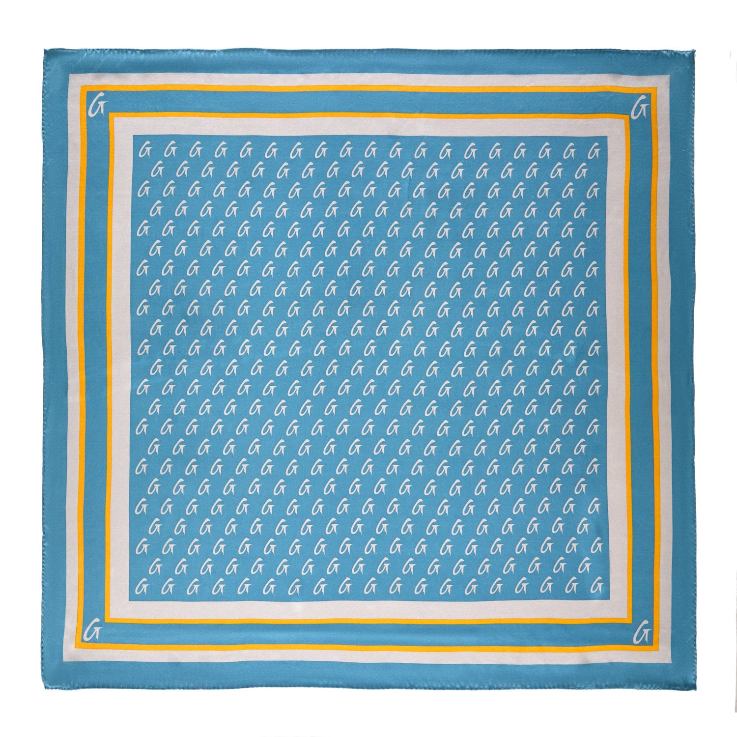 Large blue silk scarf with gold monogram pattern, featuring a border with white, yellow, and blue accents.
