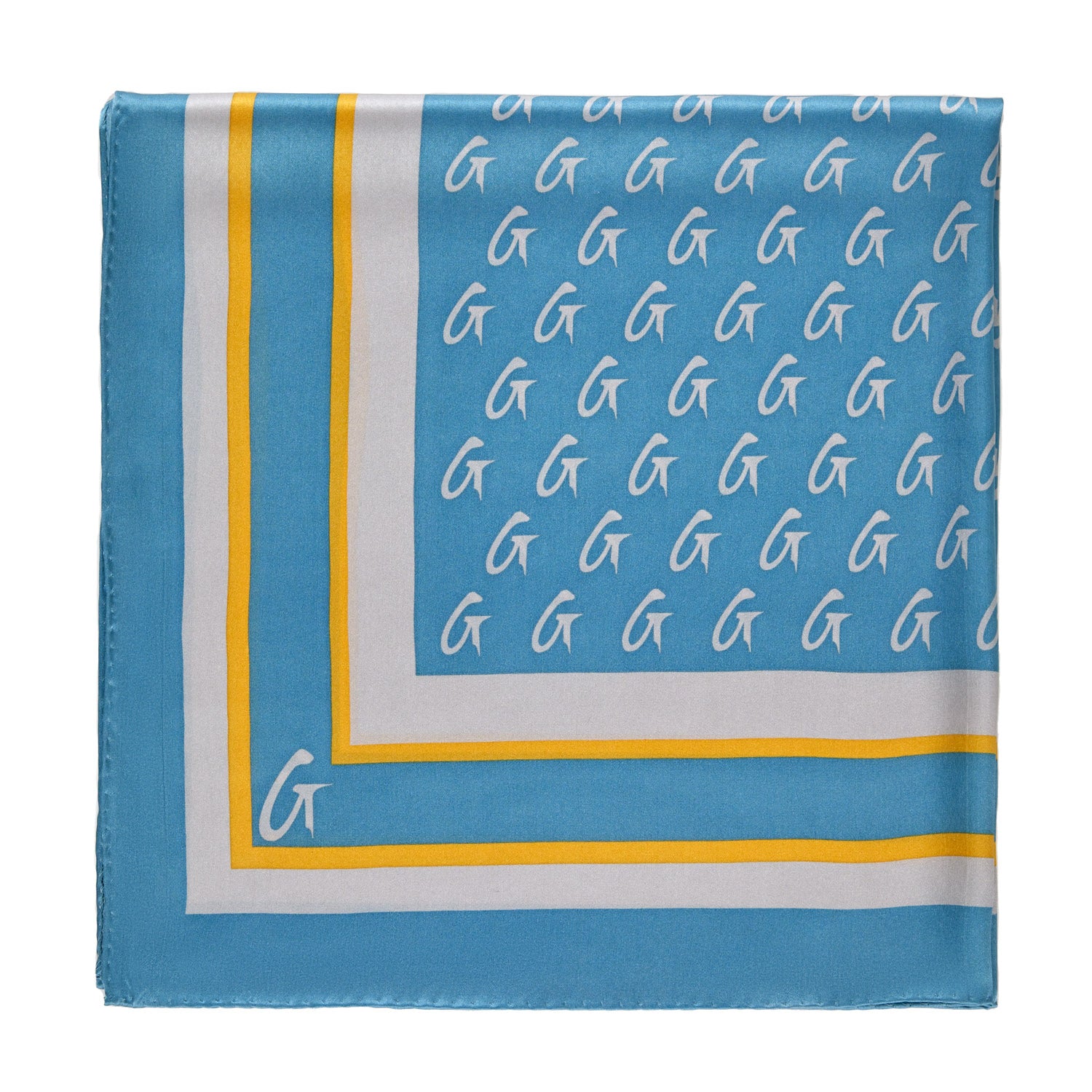 Medium silk scarf in blue and gold with a monogram pattern and border design, featuring a stylish and luxurious look.