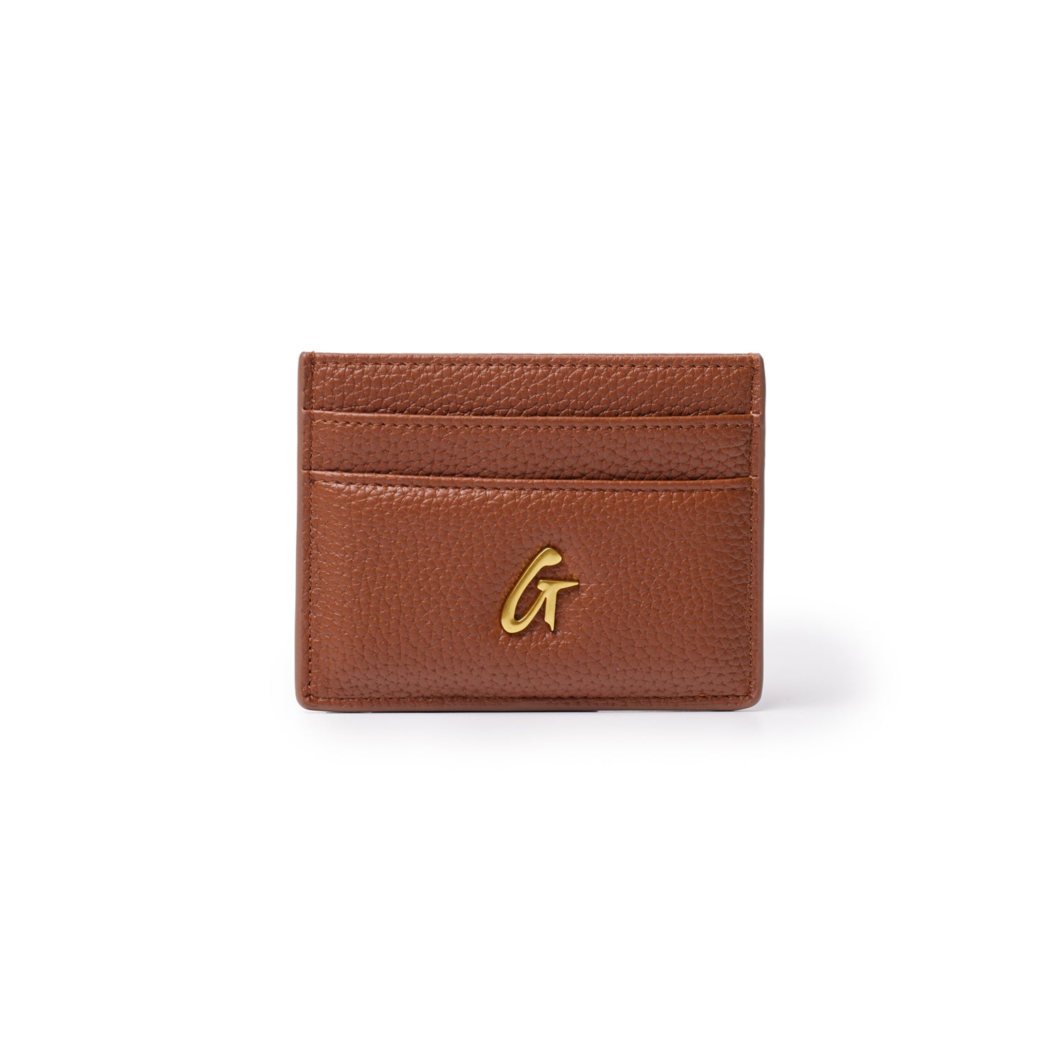 Brown pebble leather card holder with gold "G" logo and three card slots on a white background.