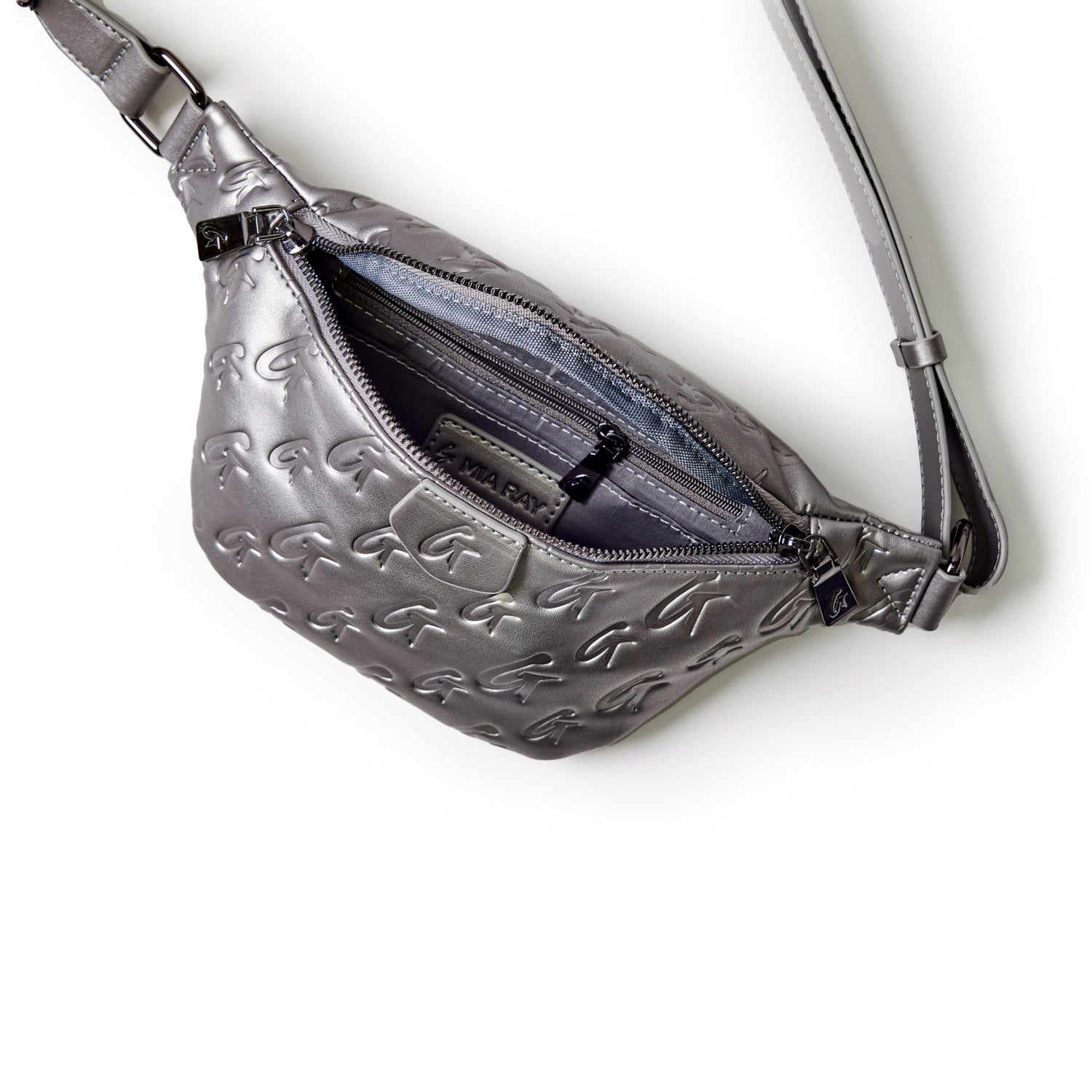 Silver mini monogram fanny pack with embossed G pattern, zip closure, and adjustable strap.