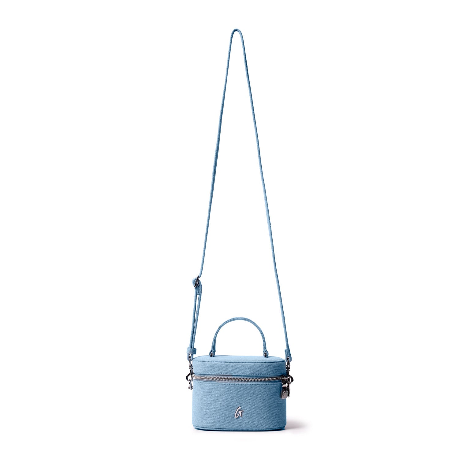 Mini denim silver vanity bag with a top handle, zip closure, and adjustable shoulder strap, featuring a silver logo.
