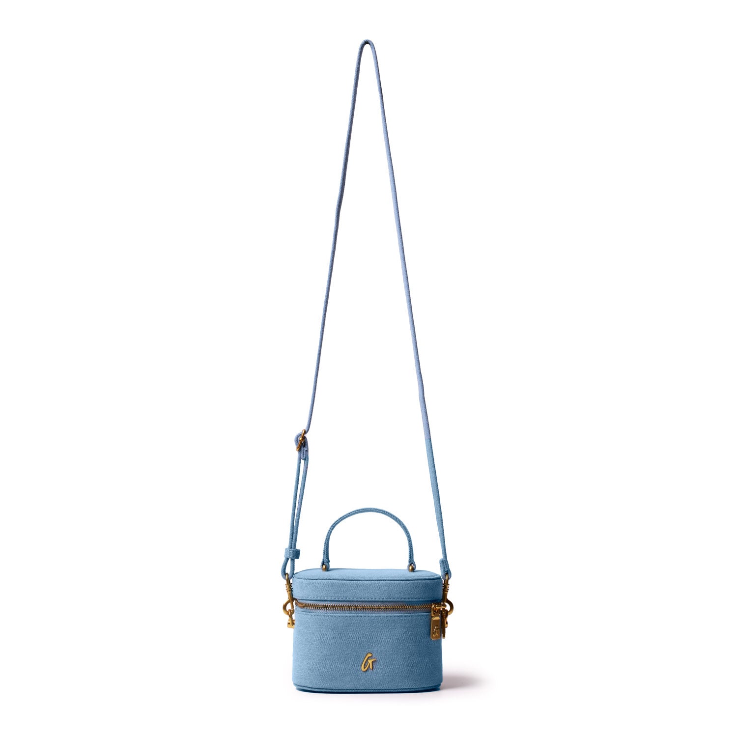 Mini denim gold vanity bag with a top handle, gold zipper, and an adjustable shoulder strap, featuring a gold logo.