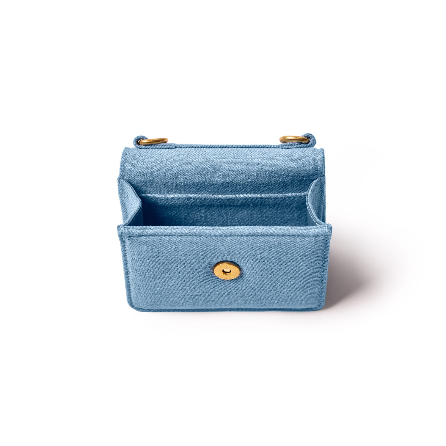 Mini denim gold WOC bag with a front flap, gold hardware, and an open interior, perfect for compact essentials.