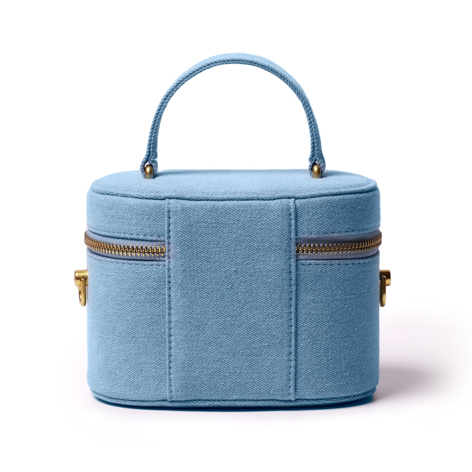 Mini denim gold vanity bag with a top handle, gold zipper accents, and compact, stylish design.