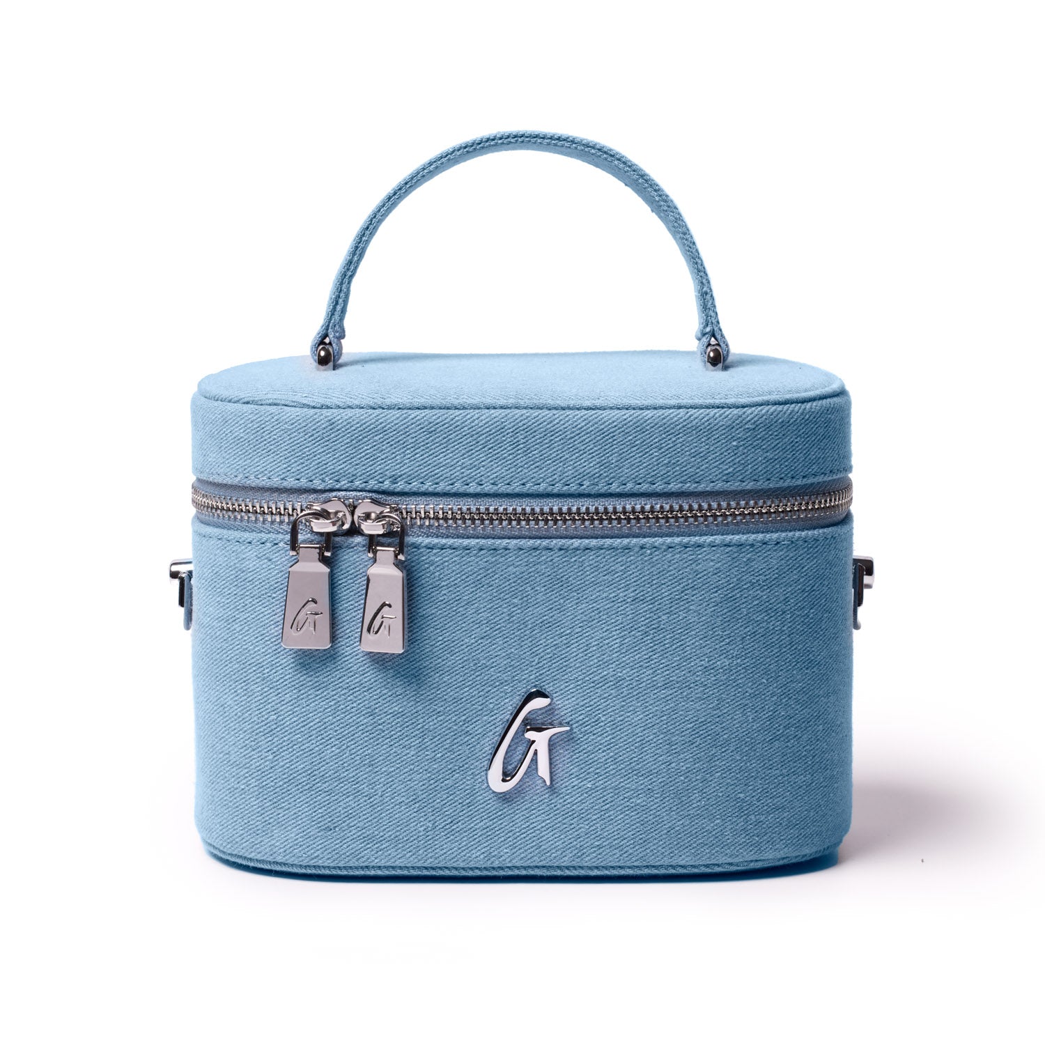 Large blue denim vanity bag with silver accents, dual zipper pulls, and a top handle for easy carrying.