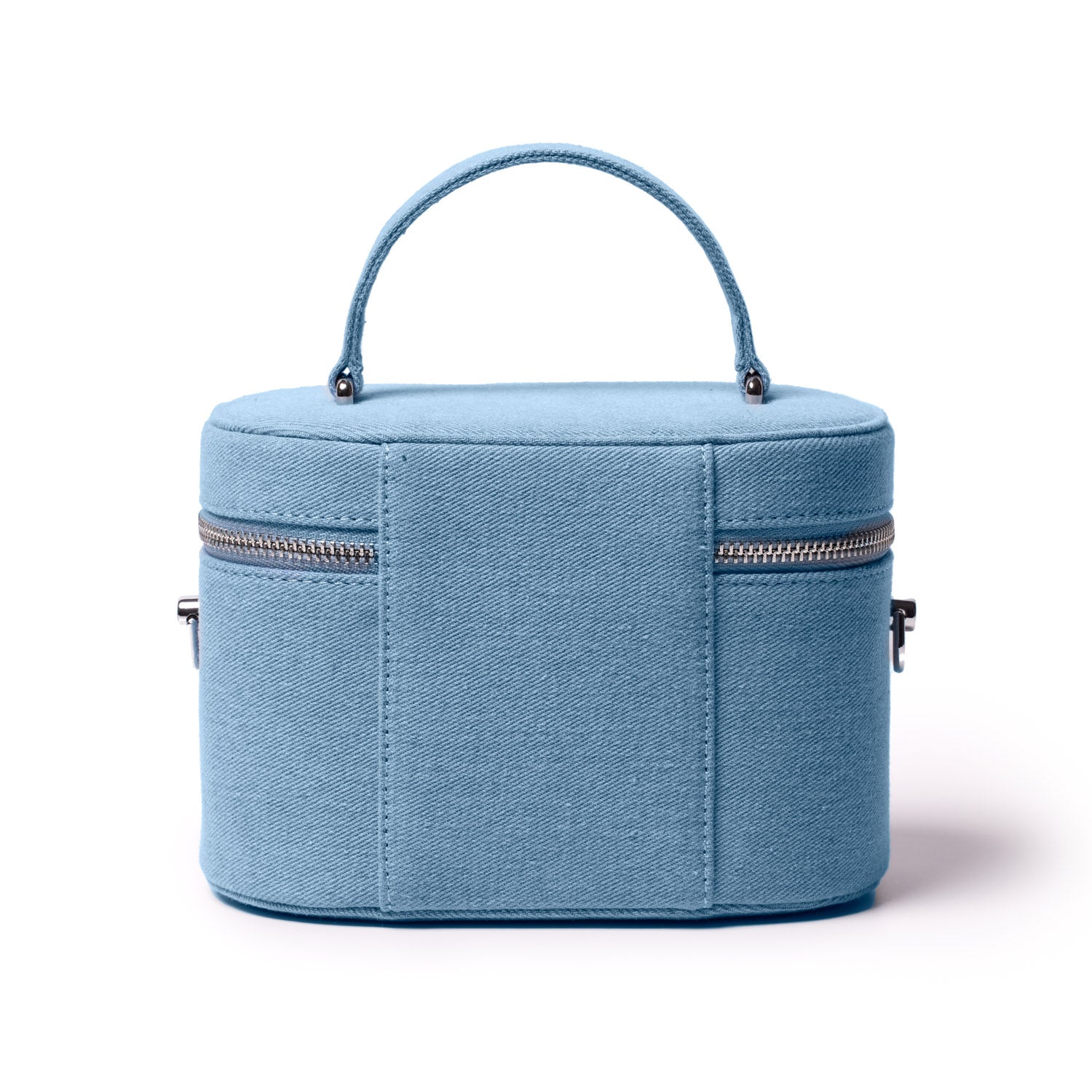 Large blue denim vanity bag with a top handle, silver zipper closure, and compact rectangular shape.