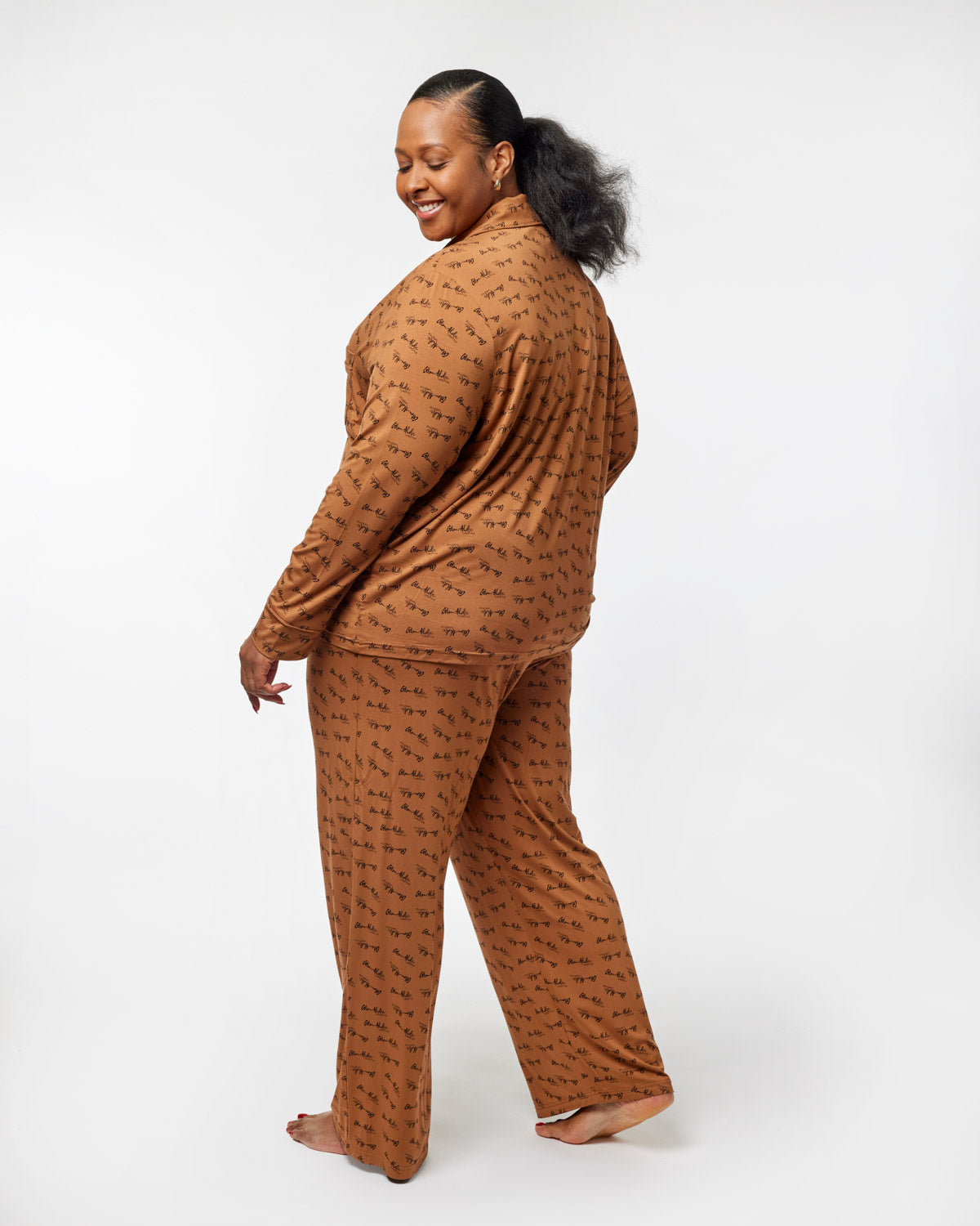 Brown signature pajamas featuring a relaxed fit and playful print, designed for comfort and style. Perfect for cozy nights.