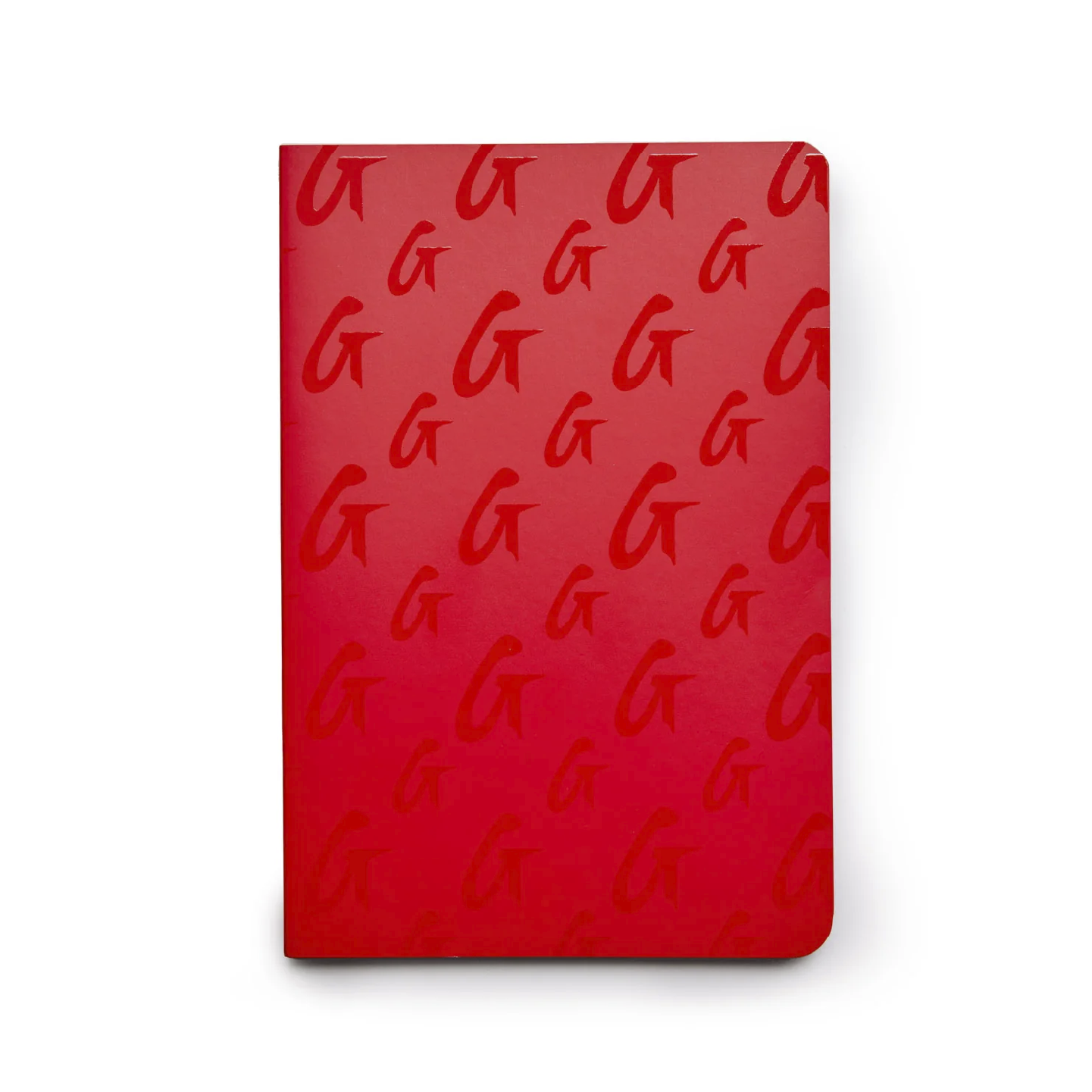 Red monogram notebook featuring a repeating G logo pattern, perfect for stylish note-taking and organization.