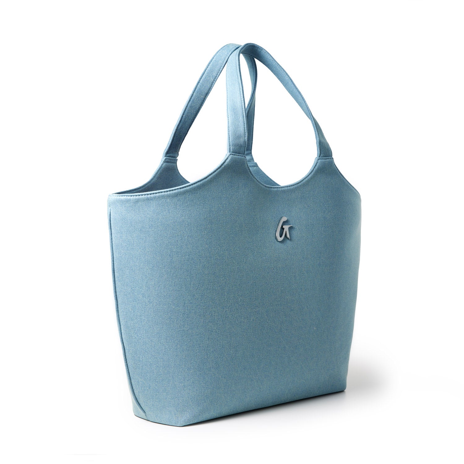 Denim silver maxi tote bag with dual shoulder straps and a small logo emblem on the front, designed for casual everyday use.