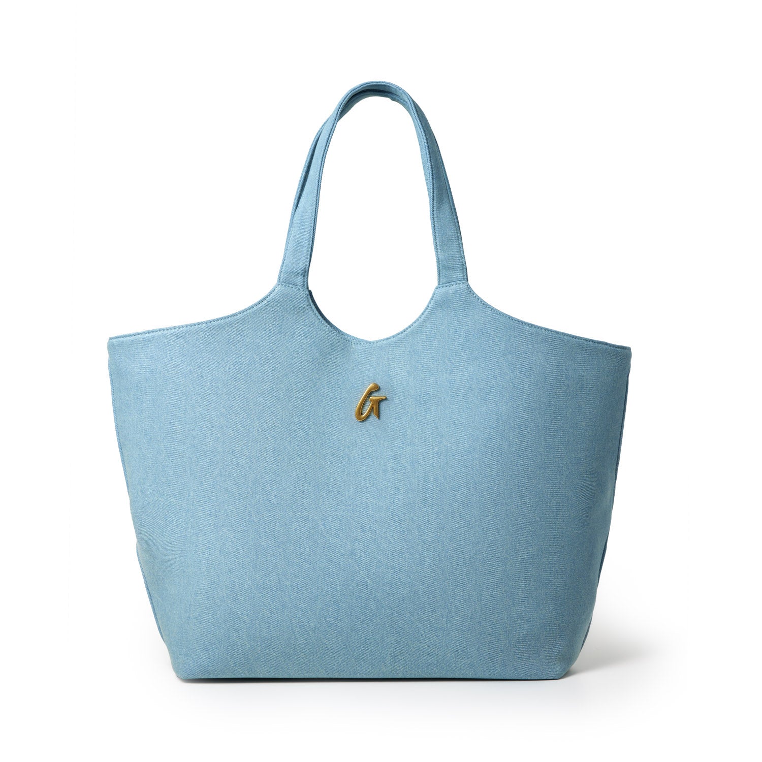 Light blue denim maxi tote bag with shoulder straps and a gold letter G emblem on the front.