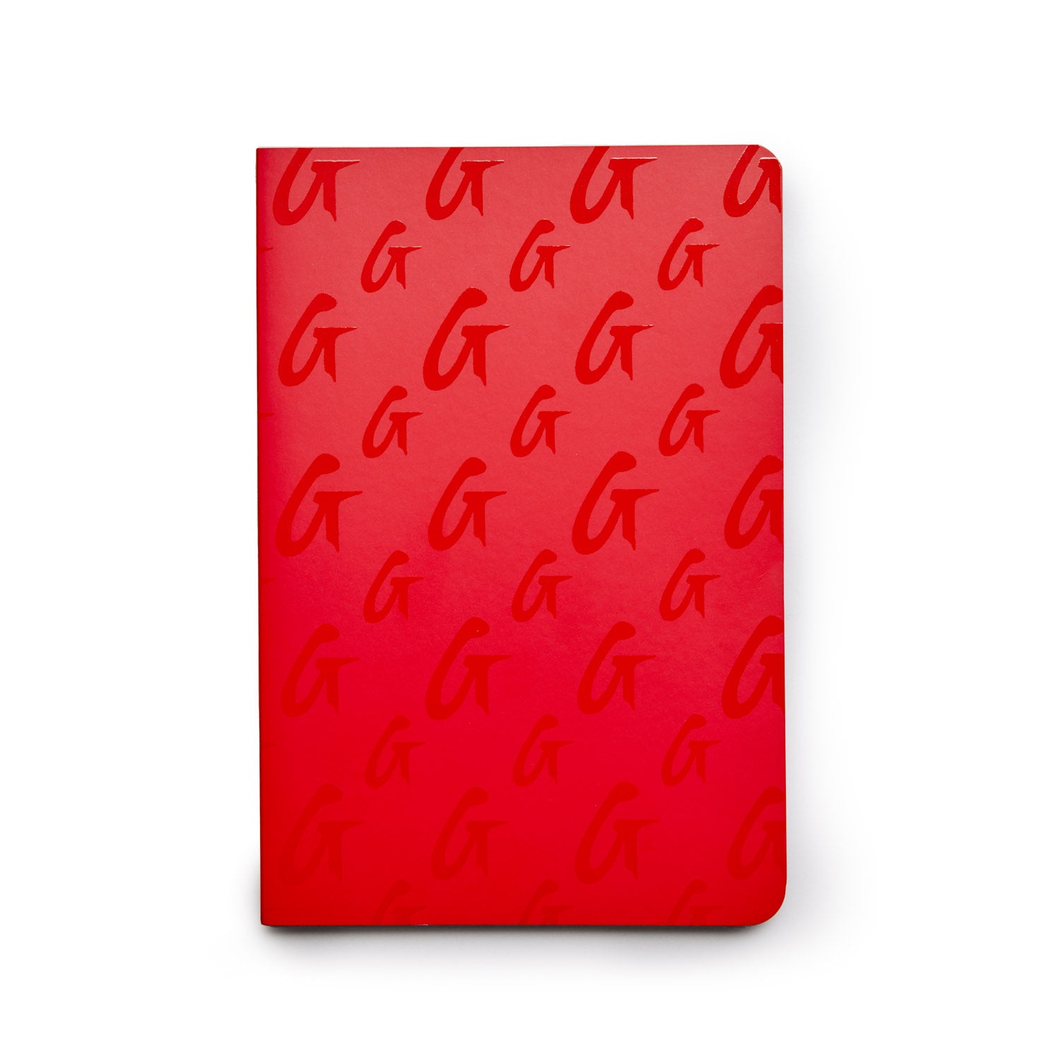 Red monogram notebook with a repeating "G" pattern on the cover, featuring rounded corners and a sleek design.