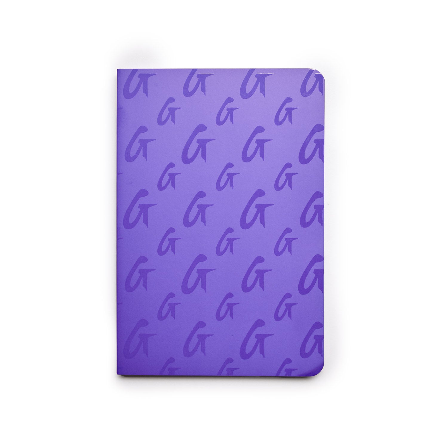 Purple monogram notebook with a repeating "G" pattern on the cover, featuring rounded corners and a sleek design.