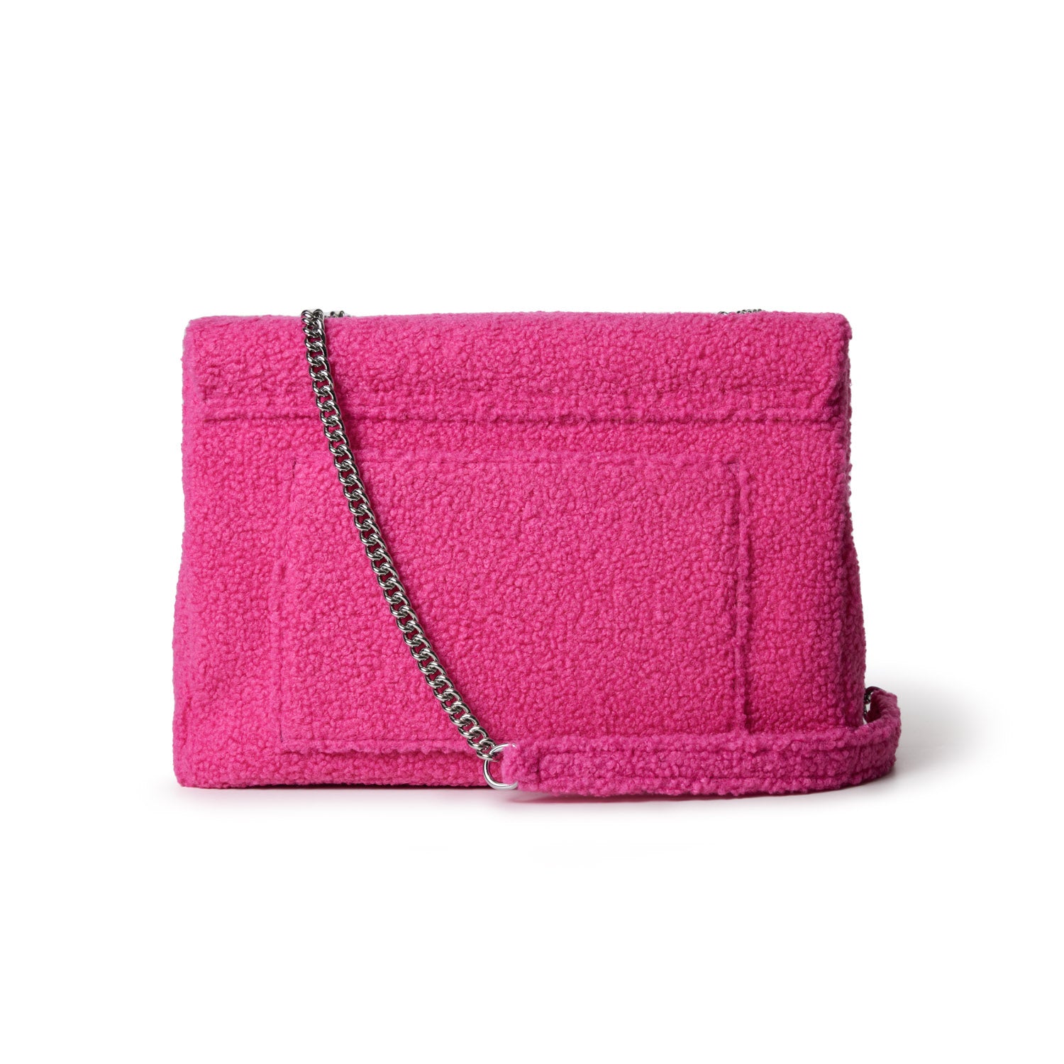Large hot pink teddy flap bag with a silver chain strap, soft textured fabric, and a front flap closure.