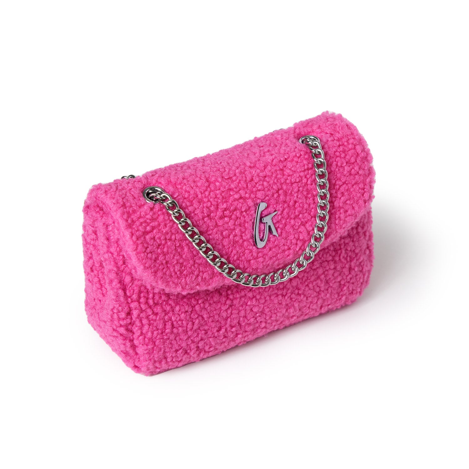 Mini teddy flap bag in hot pink with a silver chain and logo detail, made of textured plush fabric.