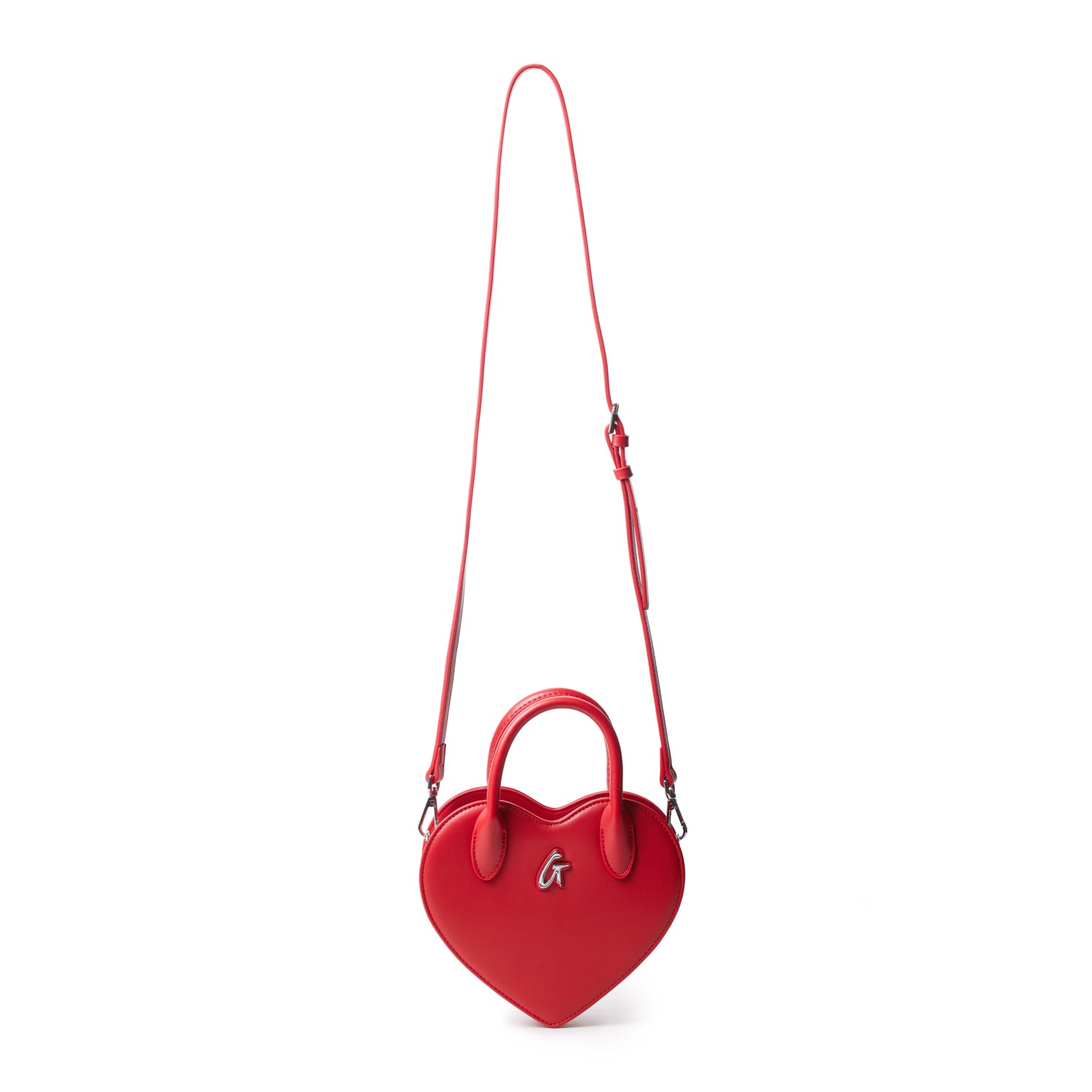 Red heart-shaped bag with a top handle and adjustable shoulder strap, featuring a silver "G" logo on the front.