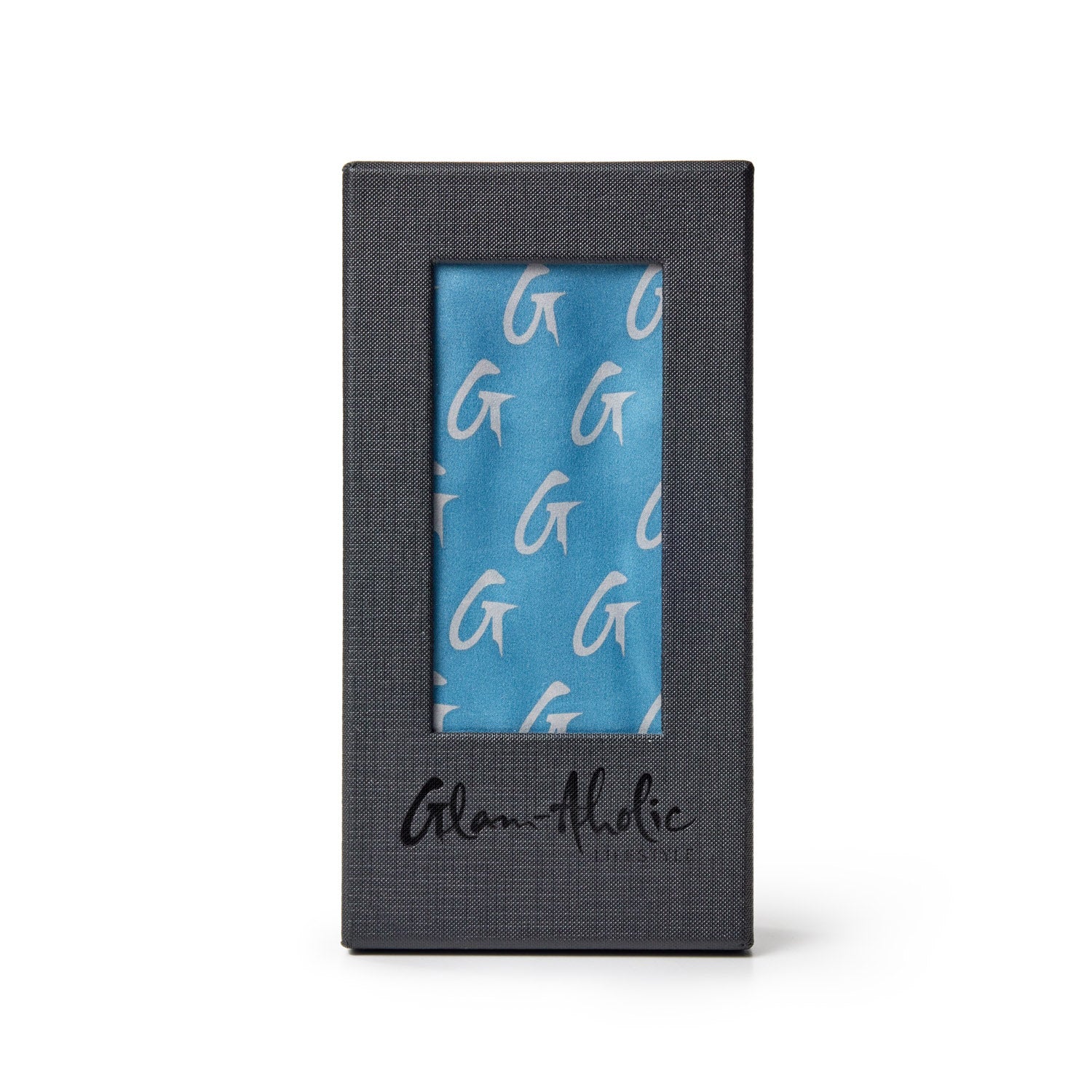 Large blue silk scarf with silver monogram pattern, displayed in a black textured box with "Glam-holic" signature.