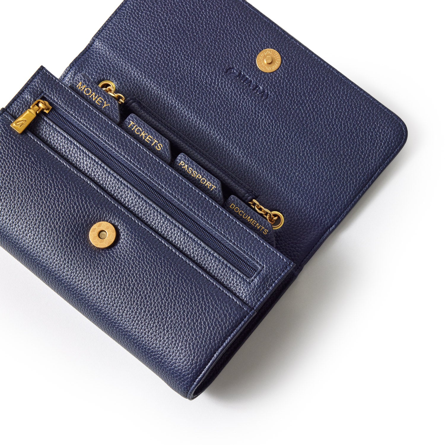 Navy Pebble Travel Wallet open with labeled compartments for money, tickets, passport, and documents, featuring gold accents.