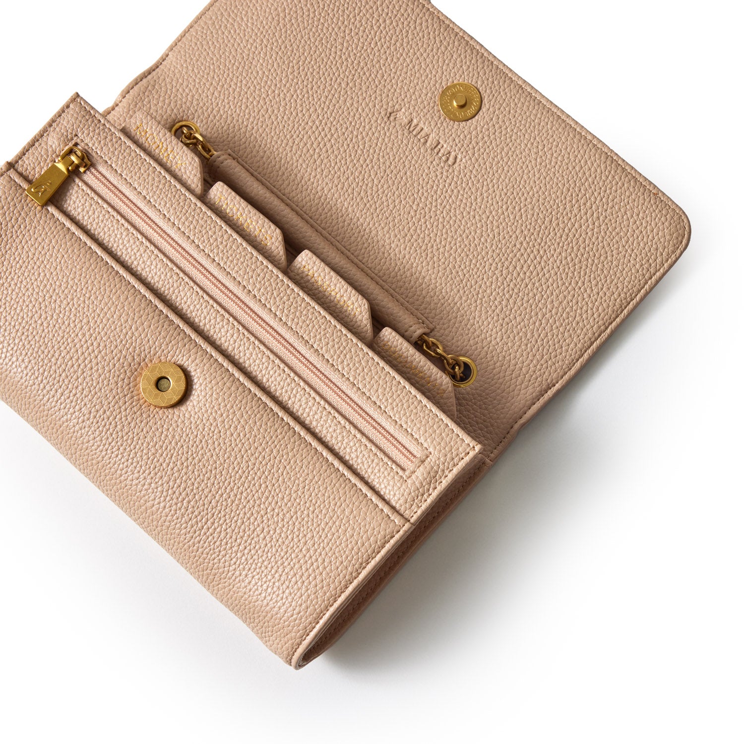 Open nude Pebble Travel Wallet with multiple card slots, zipper compartment, and gold hardware on a white background.