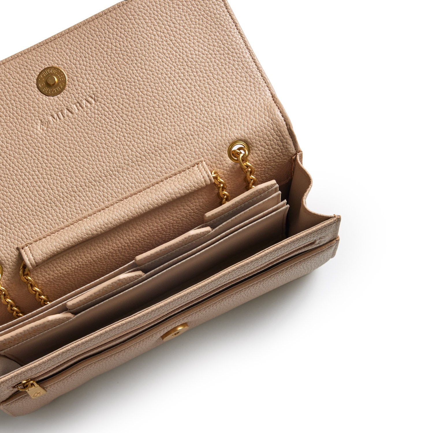 Open beige Pebble Travel Wallet in nude with gold chain details, multiple card slots, and textured leather interior.