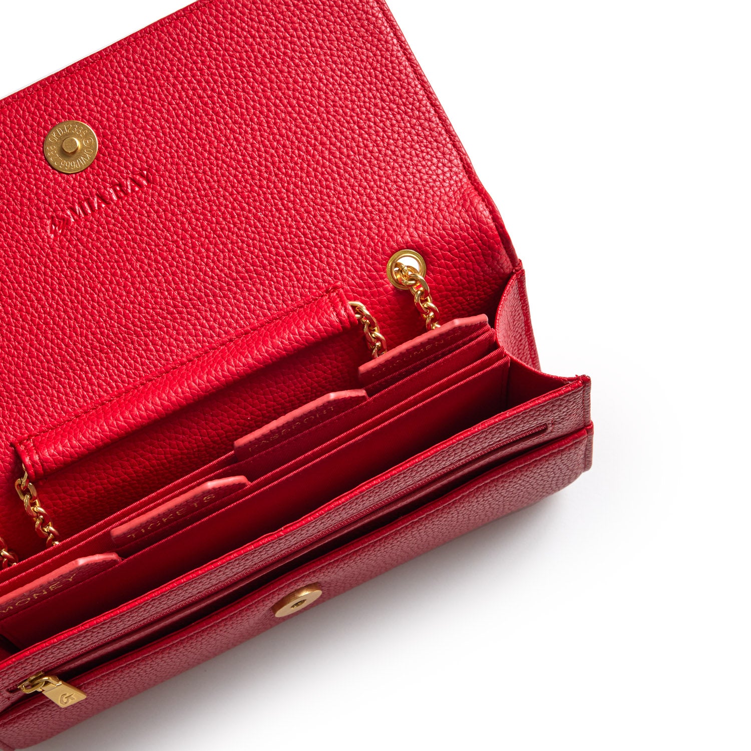 Red Pebble Travel Wallet with gold chain details, multiple compartments, and textured leather interior.