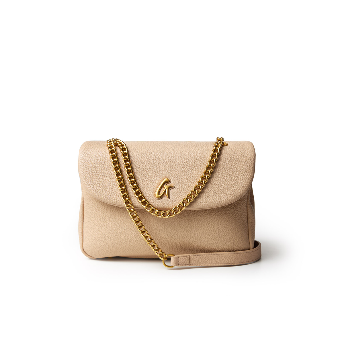 Medium pebble flap bag in nude with a gold chain strap and a gold "G" logo on the front.