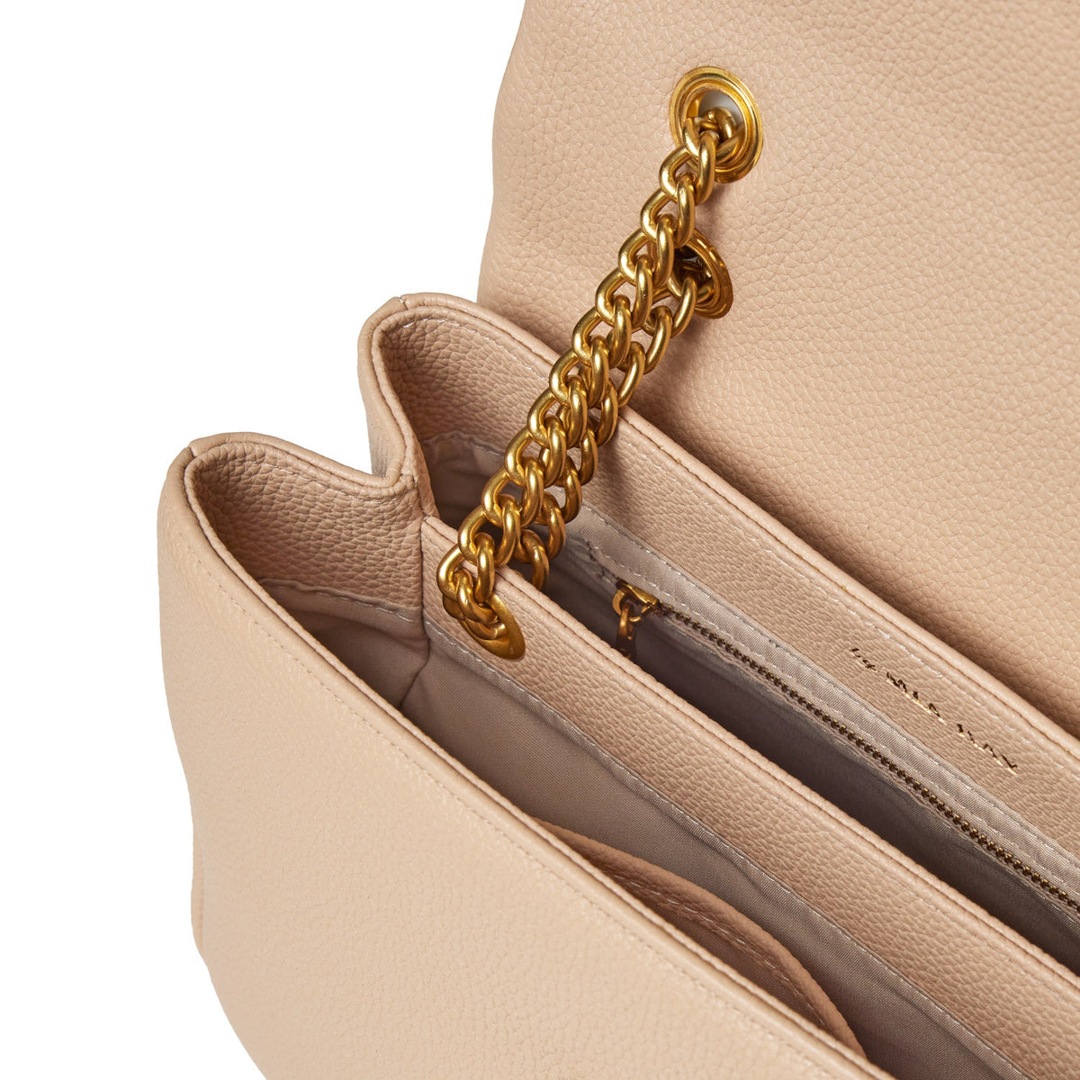 Medium nude pebble flap bag with a gold chain strap and interior zip pocket, crafted from textured pebbled leather.