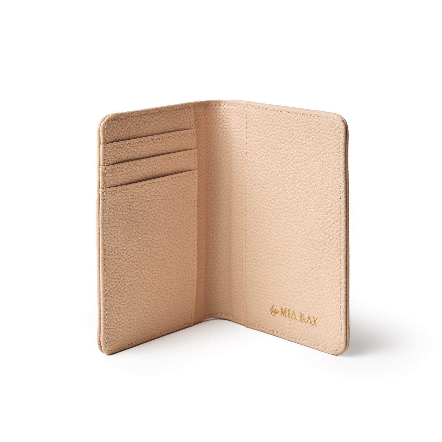Open nude-colored Pebble Passport Holder with card slots, textured leather, and gold "by MIA RAY" logo inside.