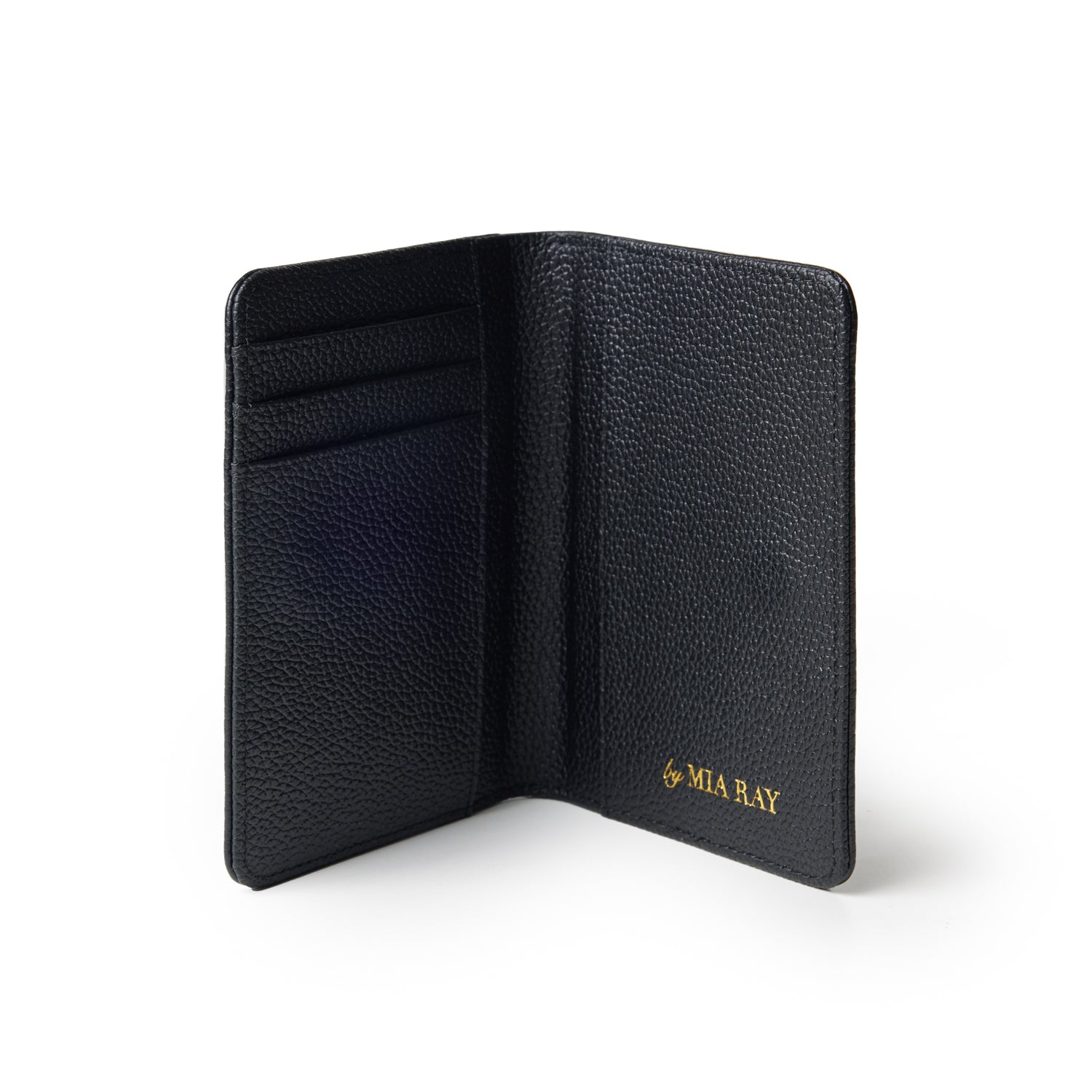 Black Pebble Passport Holder with card slots, open to show interior, featuring gold "by MIA RAY" logo.