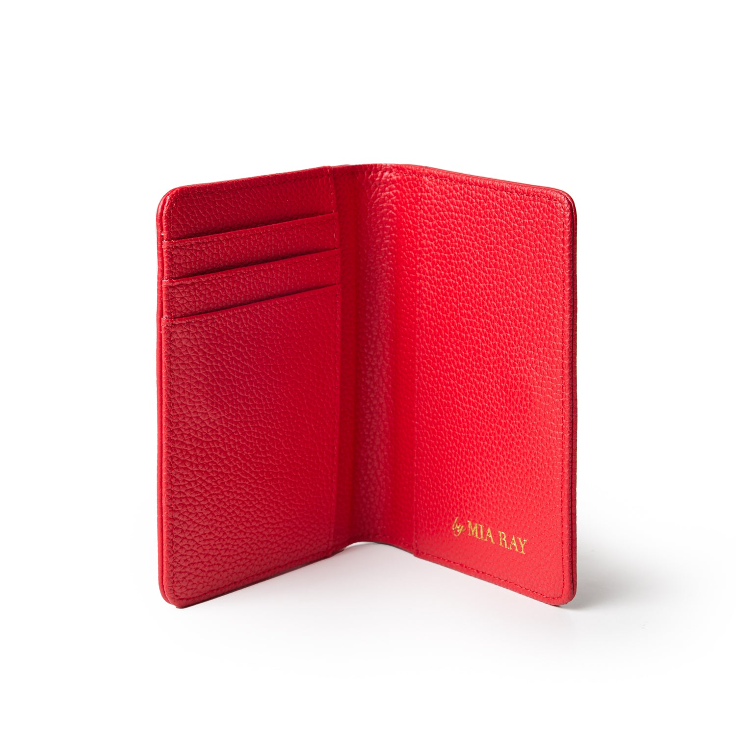 Red Pebble leather passport holder with card slots and gold embossed "by MIA RAY" logo inside.