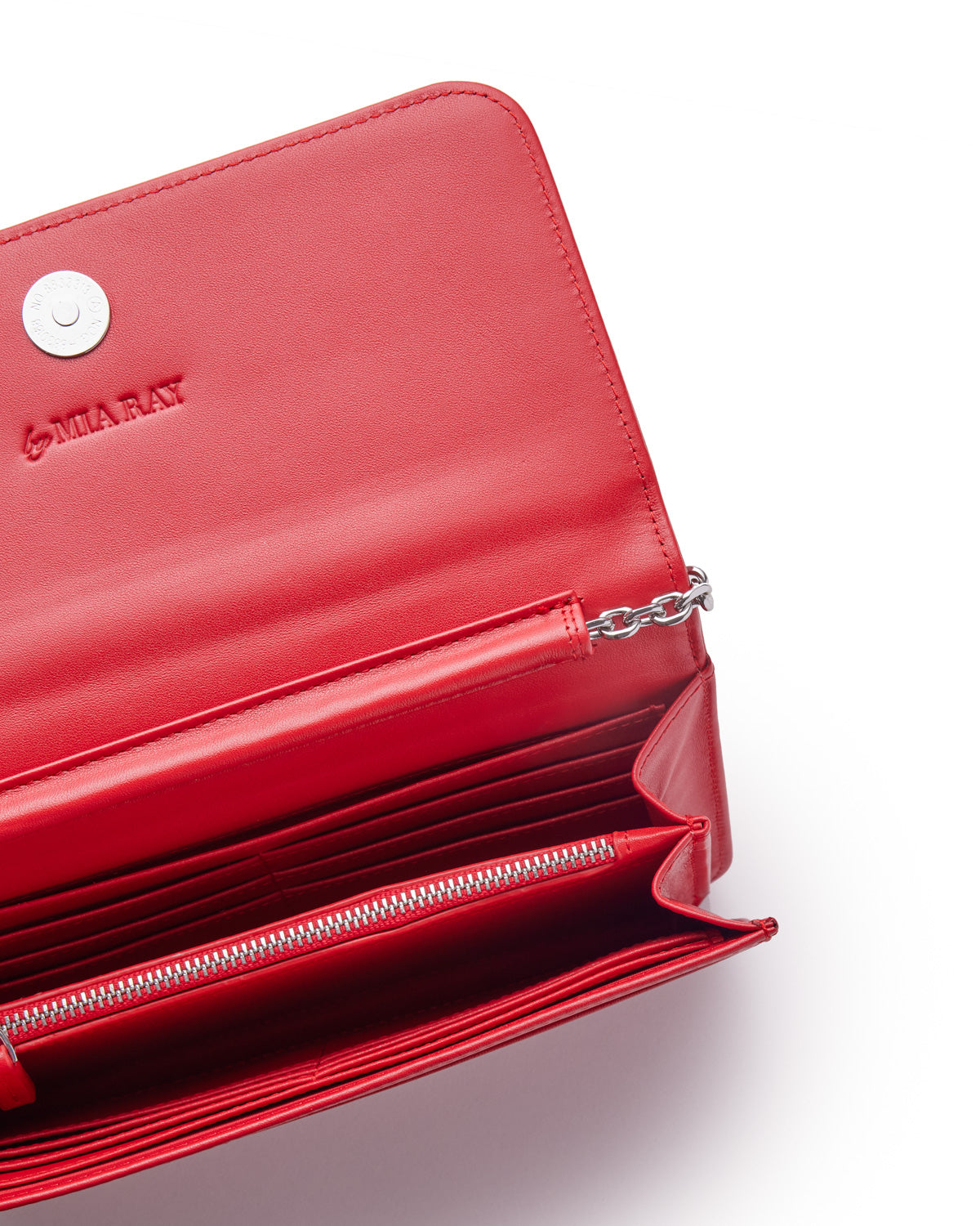 Red leather wallet with silver chain detail, multiple card slots, zippered compartment, and embossed "MIA RAY" logo.