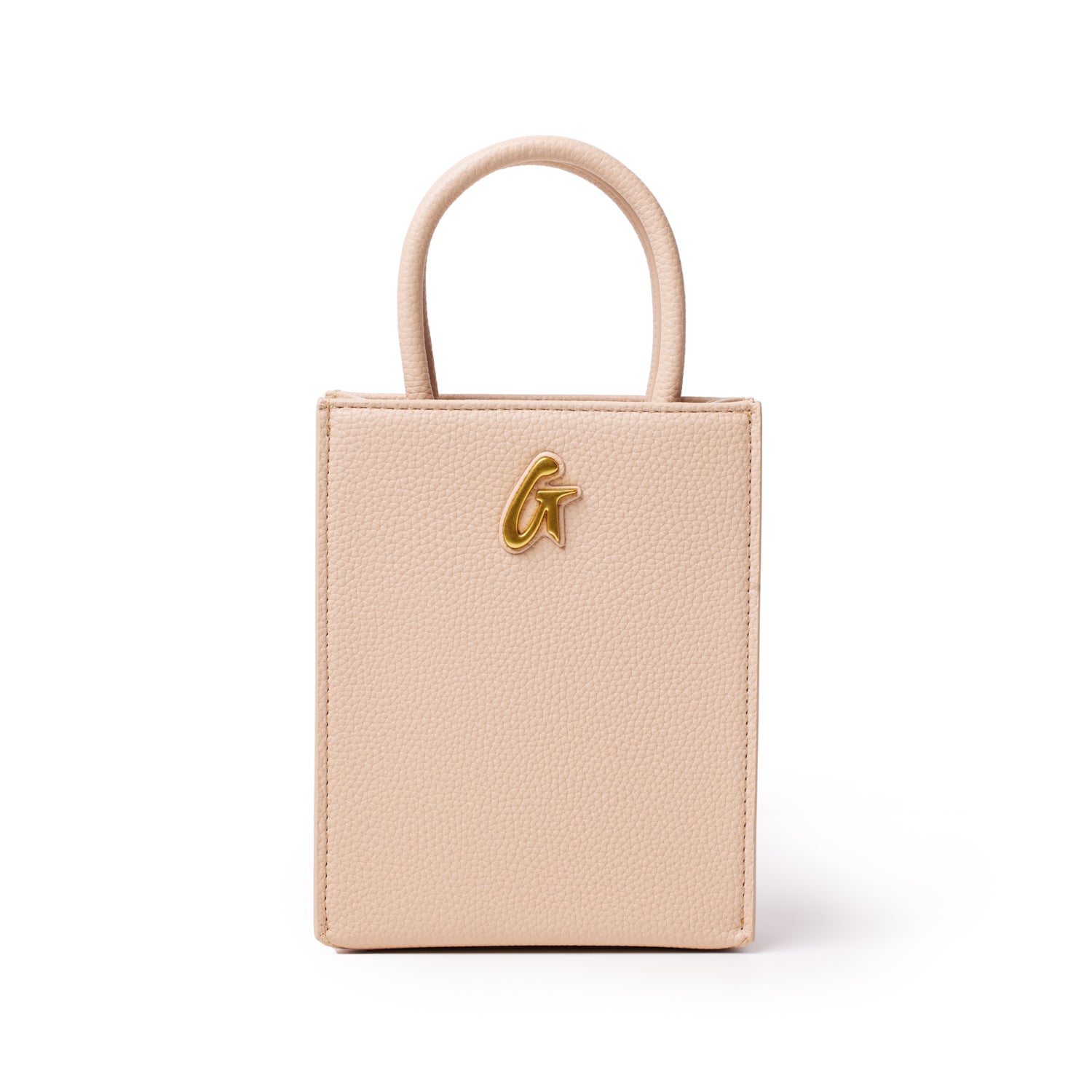 Mini Pebble Tote in nude color with a textured leather finish and a gold-tone logo accent on the front.