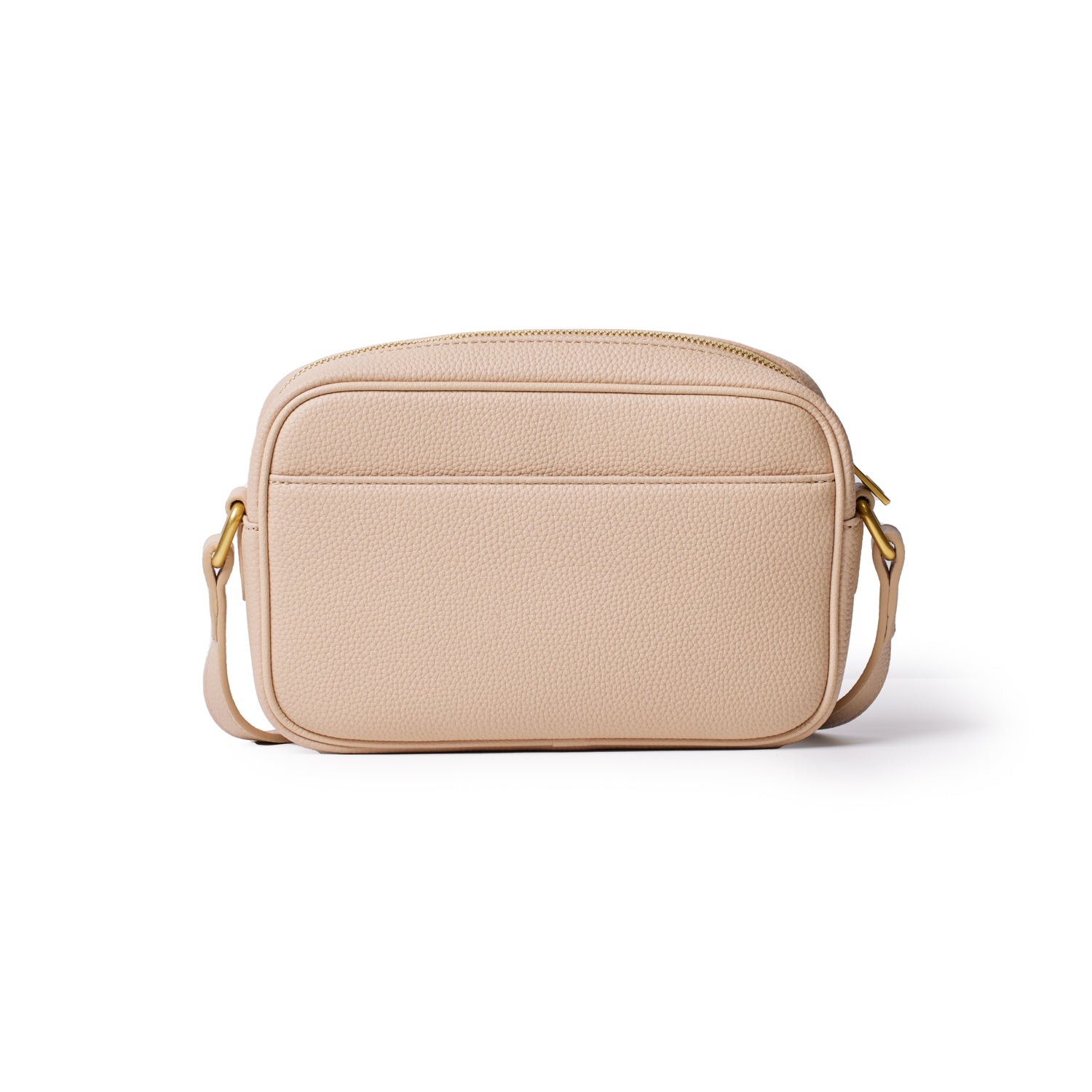 Nude-colored Pebble Camera Bag with a textured surface, gold hardware, and adjustable strap, ideal for carrying camera gear.