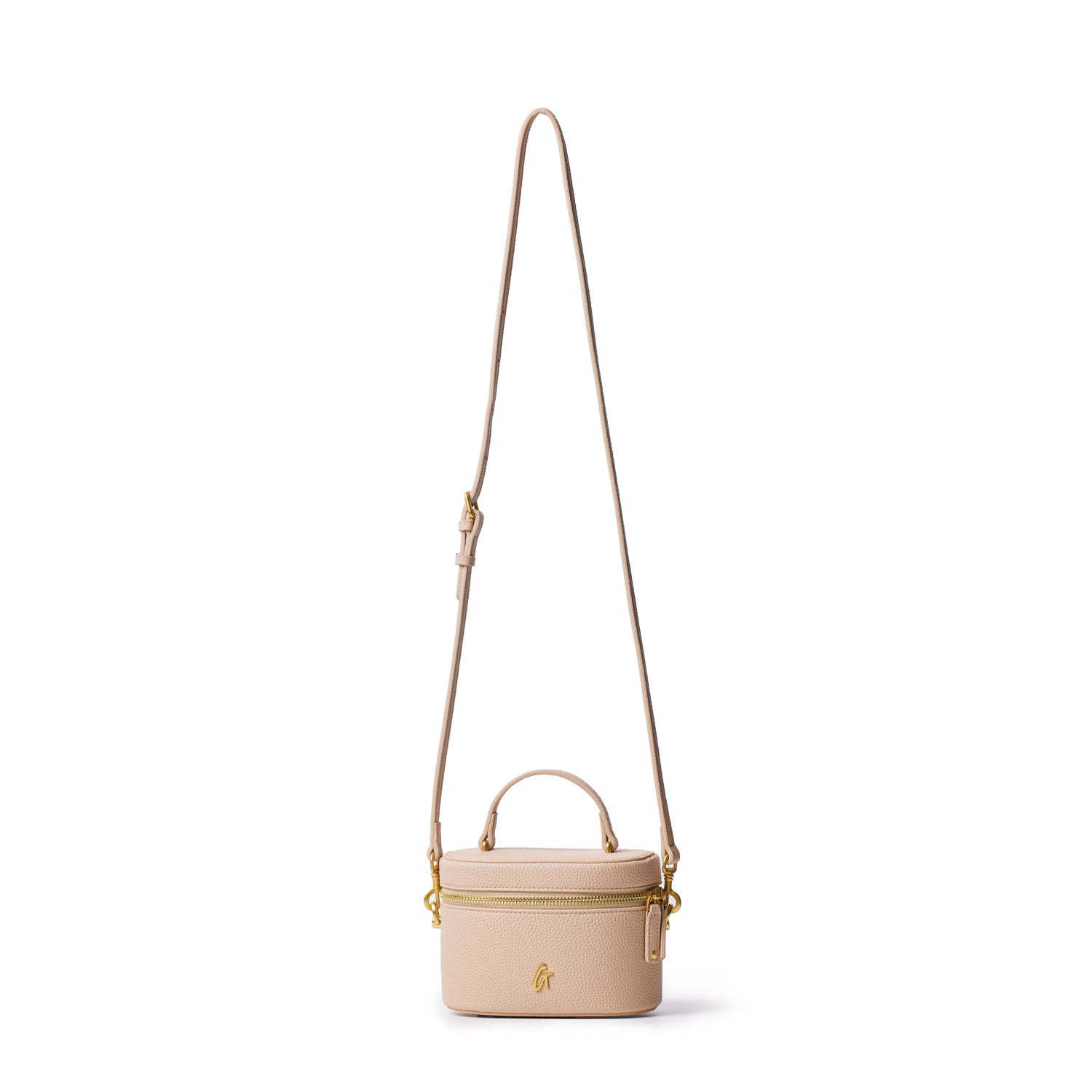 Mini pebble vanity bag in nude with a top handle, adjustable strap, gold hardware, and a front logo.