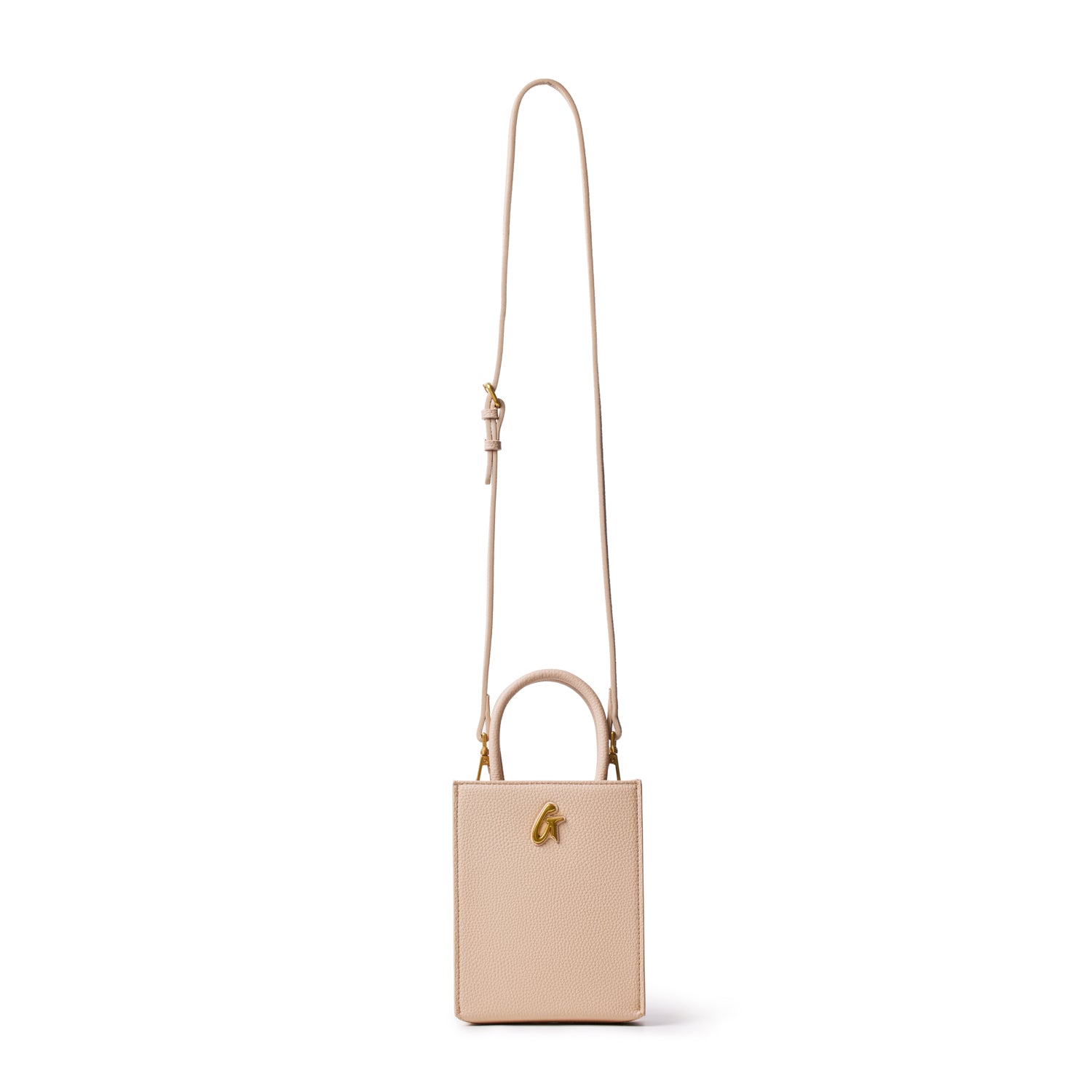 Mini pebble tote bag in nude color with a gold logo, featuring a top handle and adjustable shoulder strap for versatile wear.