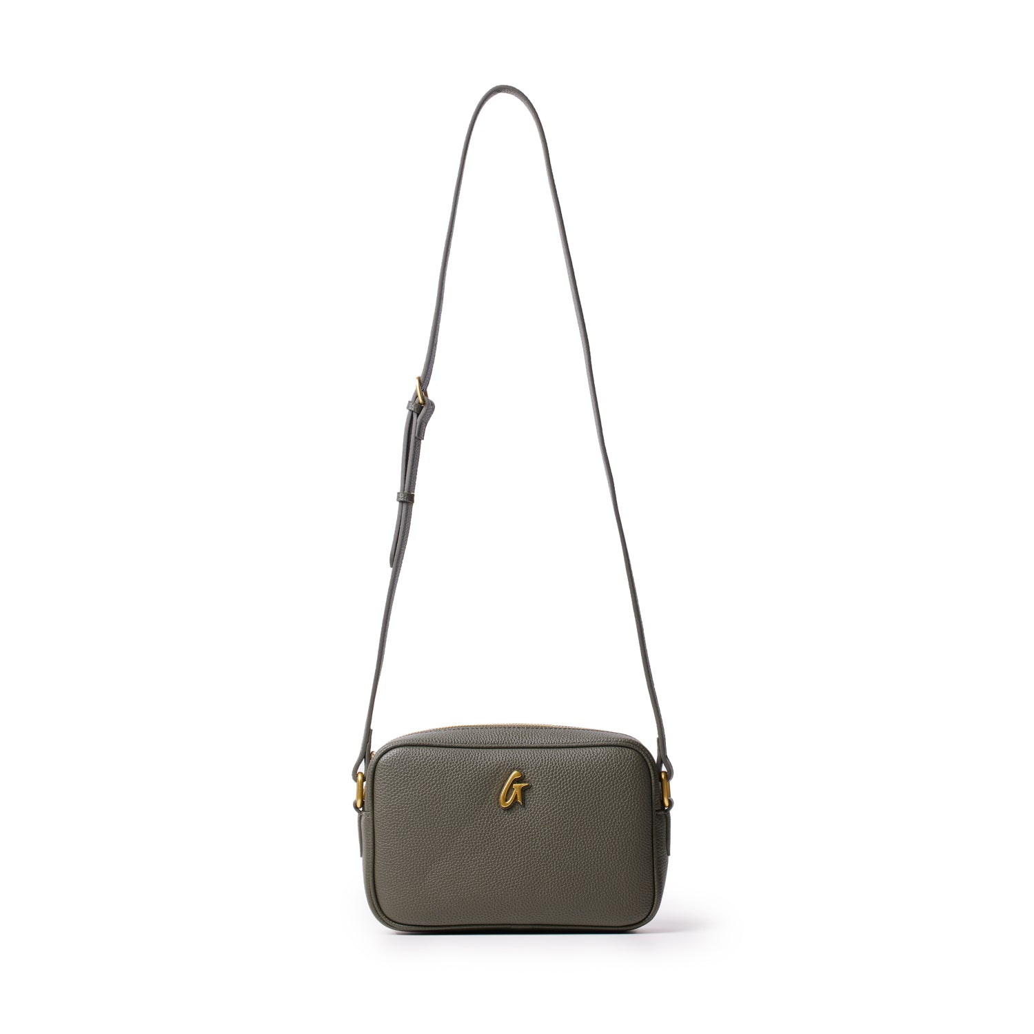 Olive green pebble leather camera bag with a gold "G" logo and adjustable strap, designed for stylish carrying.