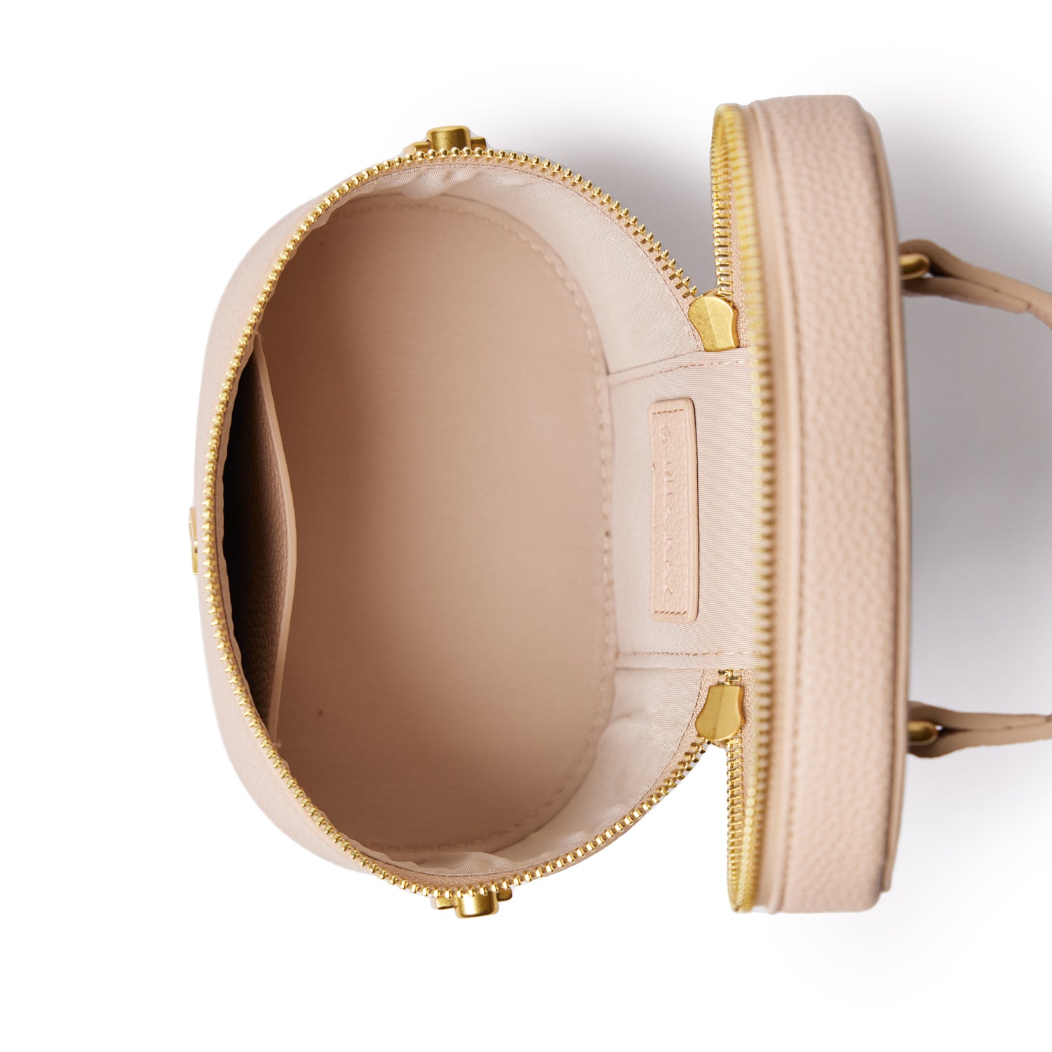 Open nude mini pebble vanity bag with gold zipper, showing interior compartments and soft beige lining.