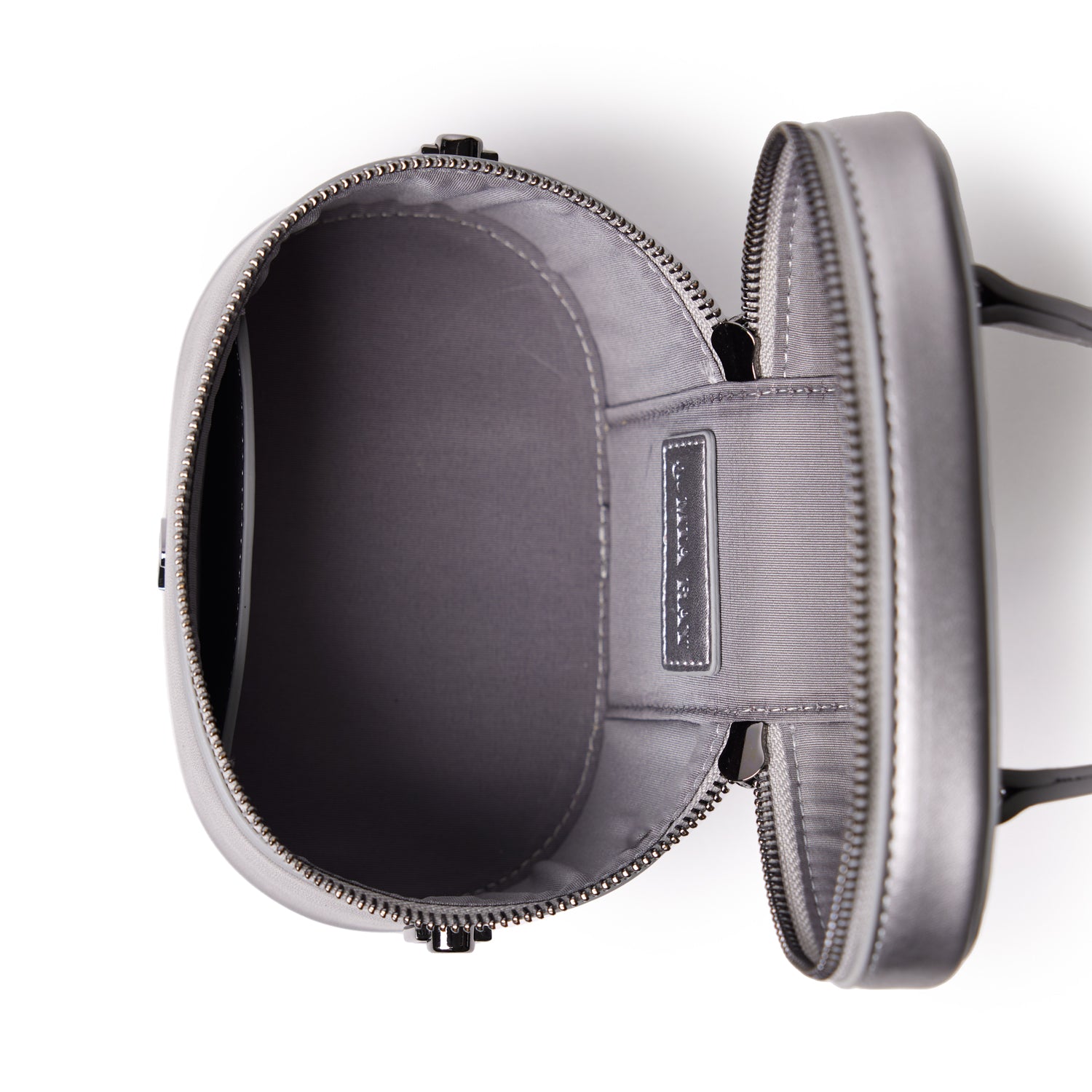 Mini smooth gunmetal vanity bag in platinum color, open view showing spacious interior and sleek design.
