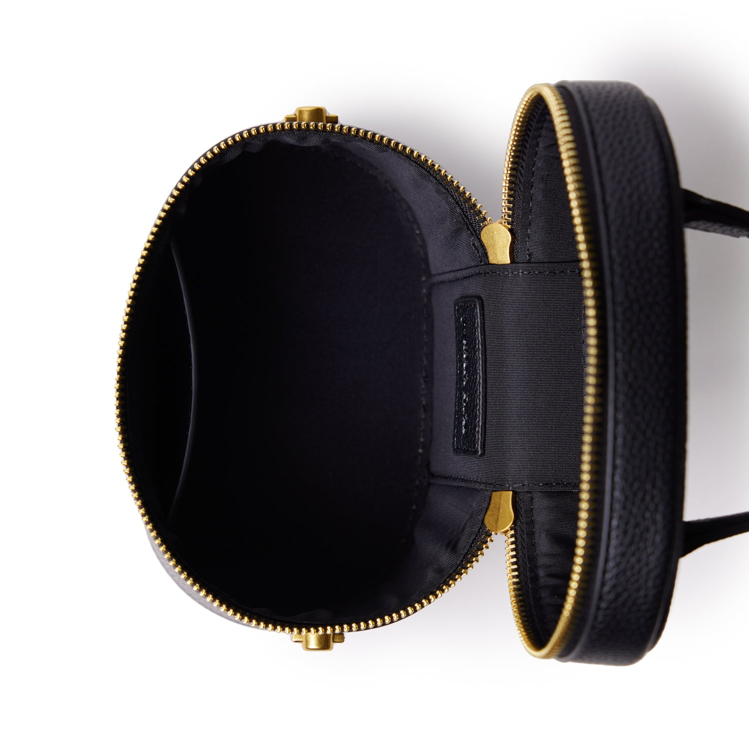 Small black vanity bag with a smooth texture, gold zipper, and interior compartments for organizing essentials.