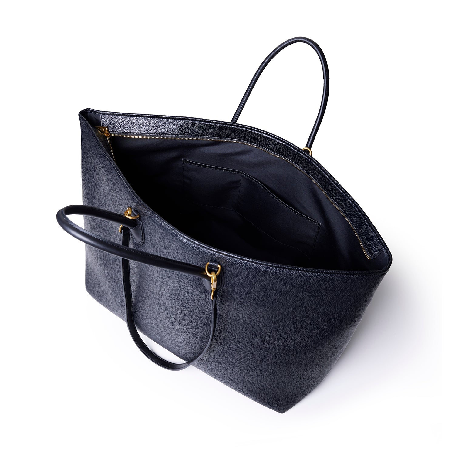 Black jumbo pebble tote bag with gold hardware, open interior with pocket, and dual top handles on a white background.