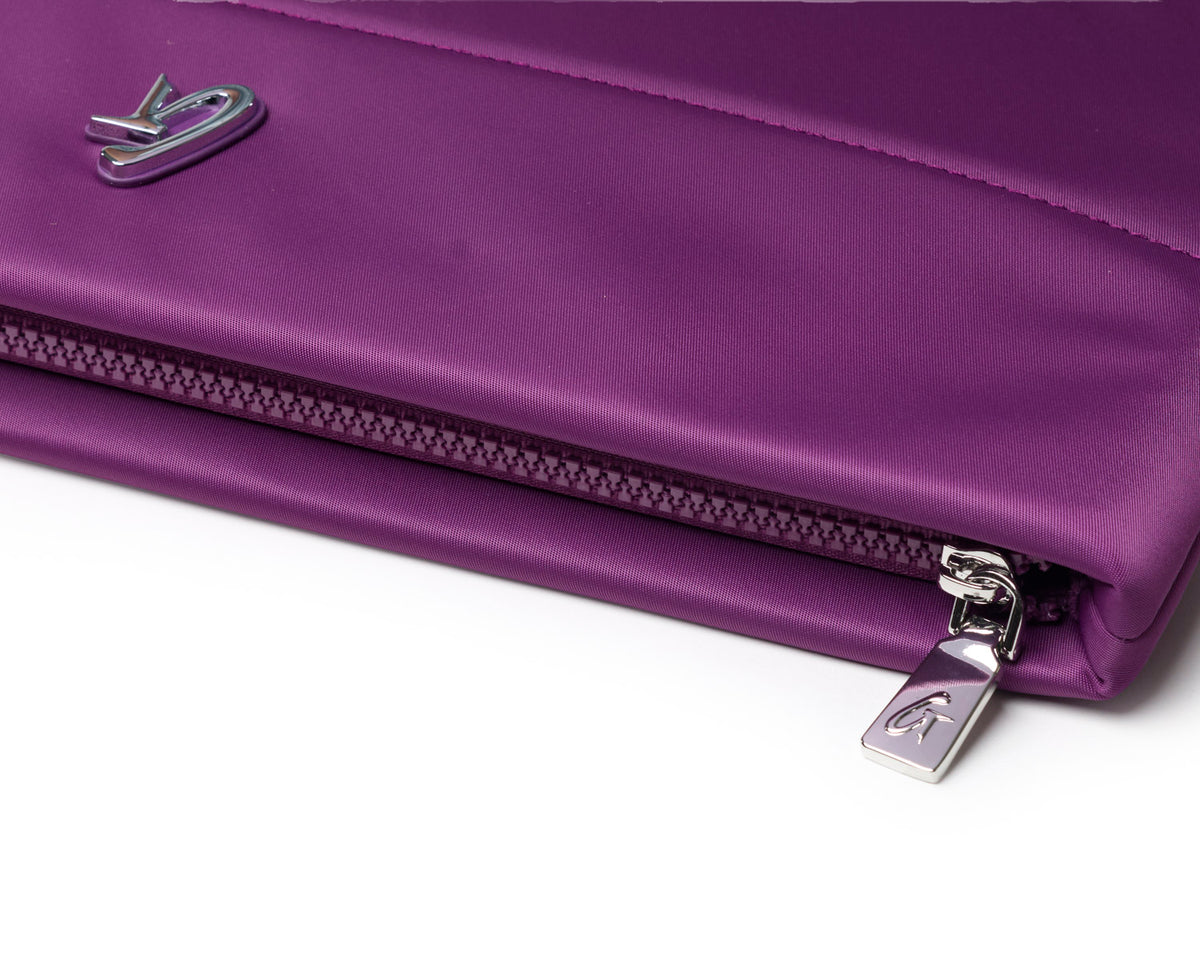 Purple nylon laptop sleeve featuring a sleek design and a silver zipper for secure closure. Perfect for stylish protection.