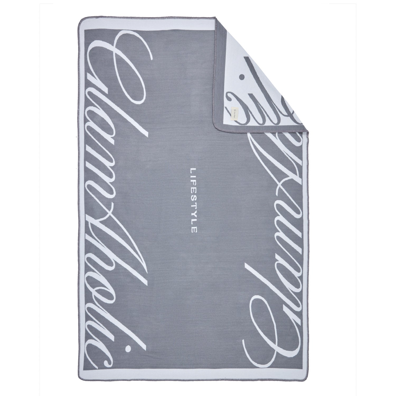 Gray luxury throw blanket with white script design and "LIFESTYLE" text in the center, featuring a soft, plush texture.