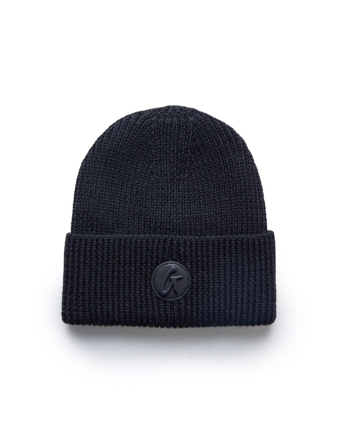 Black classic beanie hat with a folded brim and a small circular logo patch on the front.