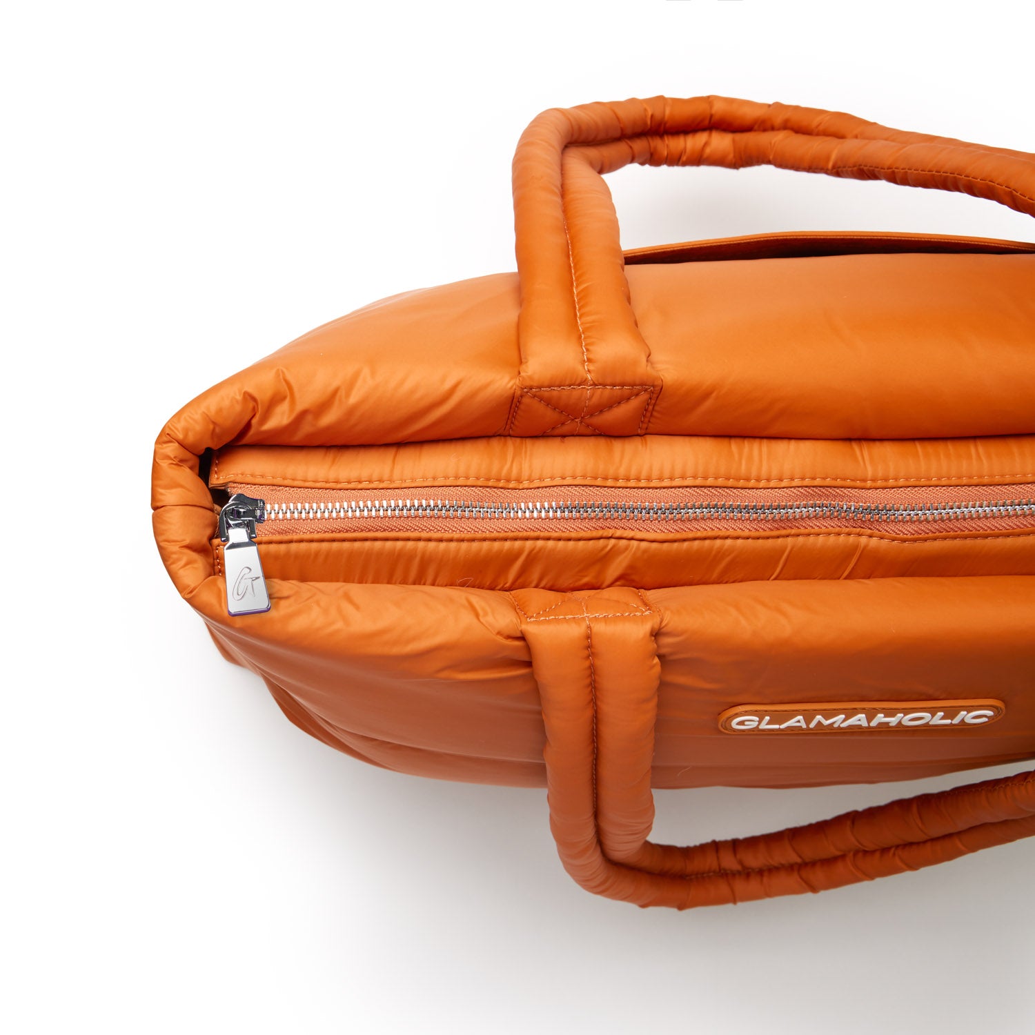 Brown athletic nylon tote bag featuring a zippered closure and padded handles for comfortable carrying.