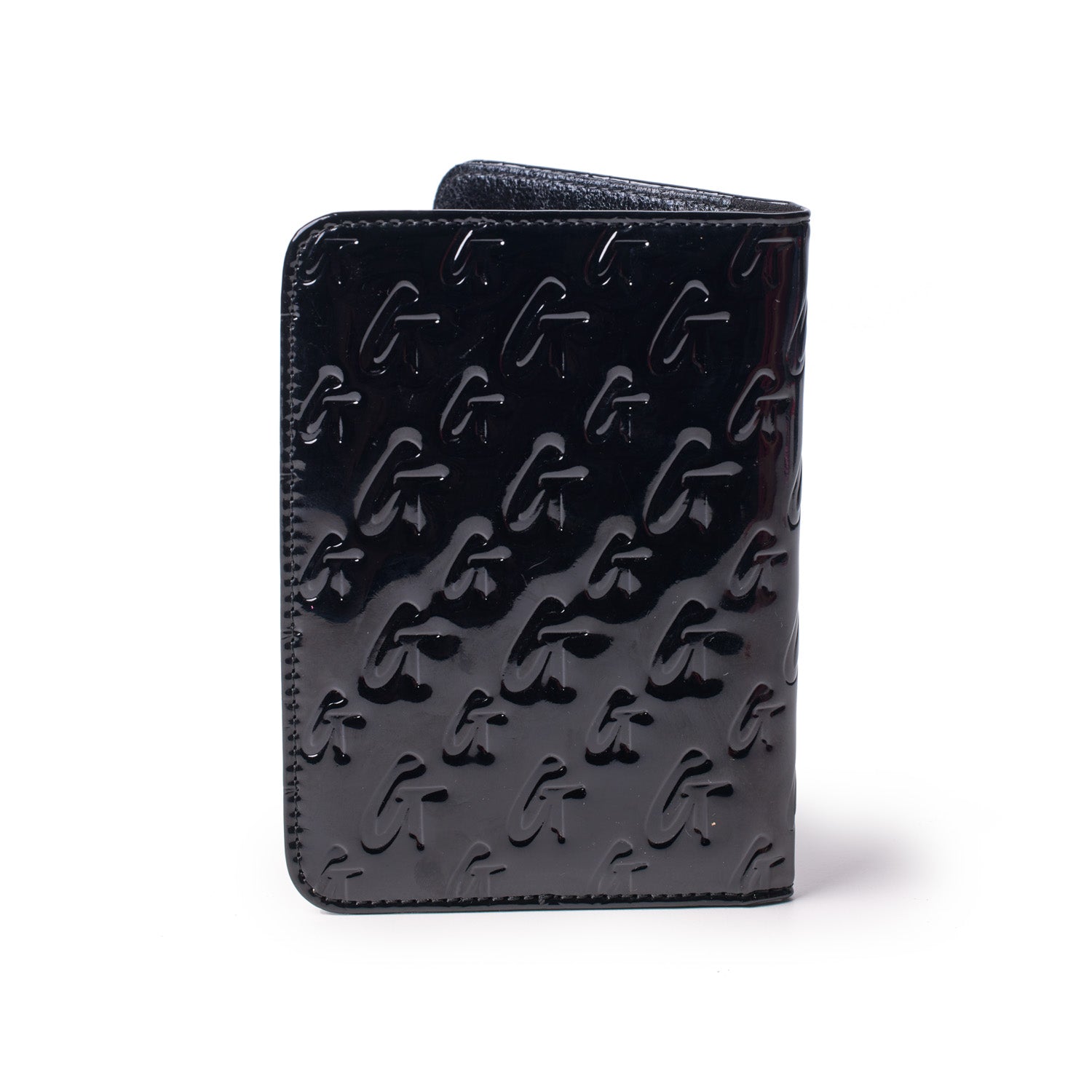 Mirror black Monogram passport holder with embossed G pattern, sleek and glossy finish, compact travel accessory.