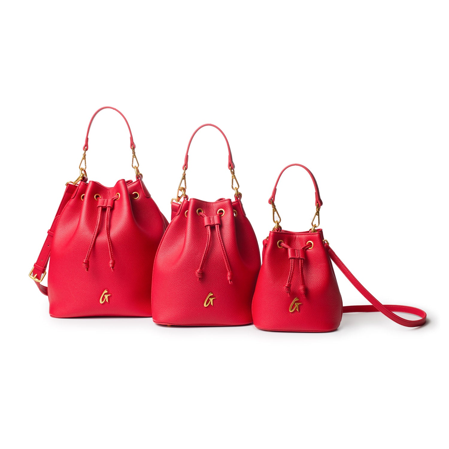 Three red medium pebble bucket bags with gold hardware and adjustable straps, displayed against a white background.