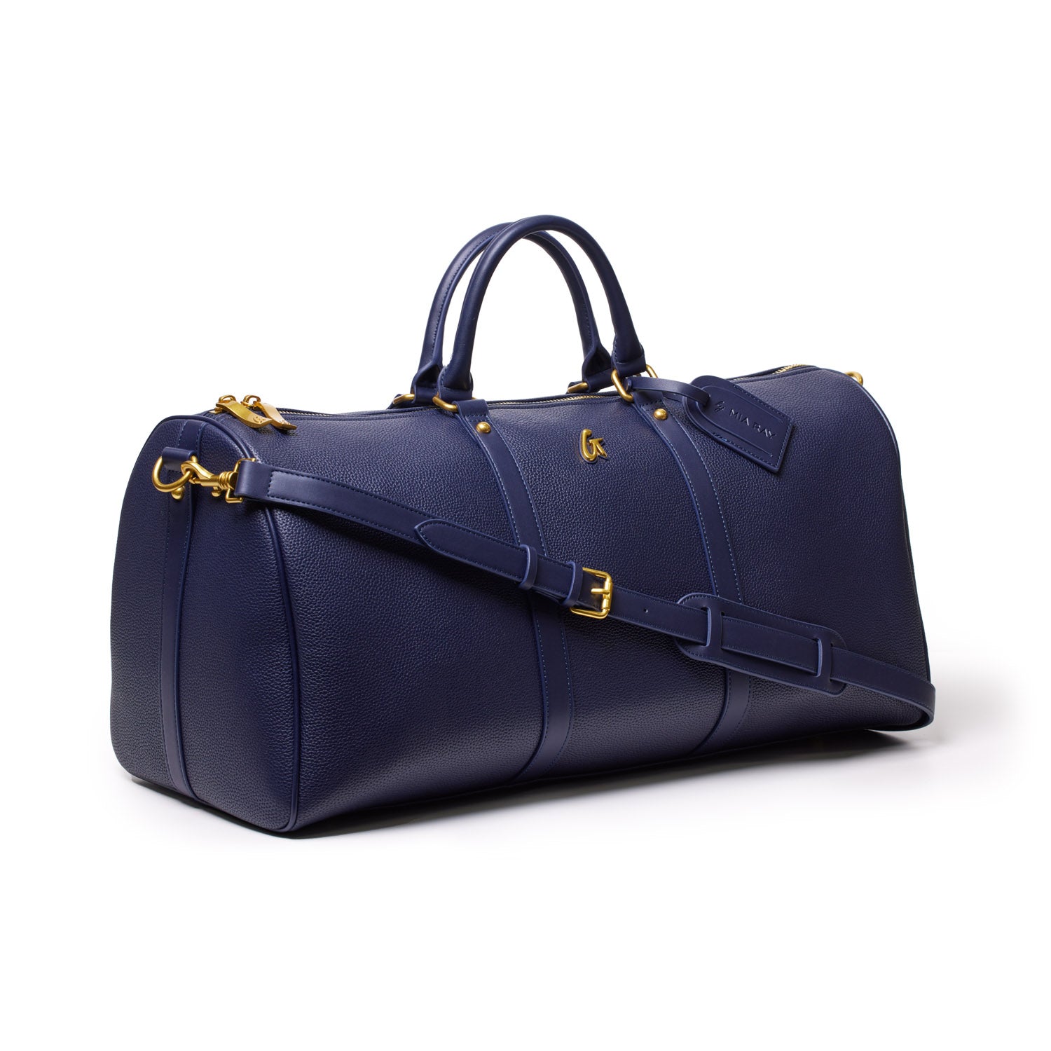Navy Pebble Duffle Bag with gold hardware, dual handles, adjustable strap, and a luggage tag, perfect for travel.