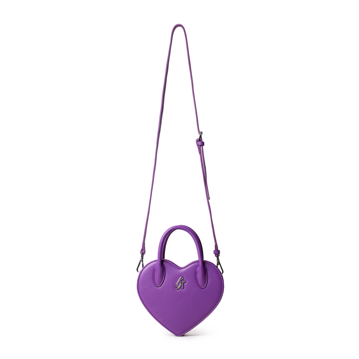 Purple heart-shaped bag with a top handle and adjustable shoulder strap, featuring a silver logo on the front.