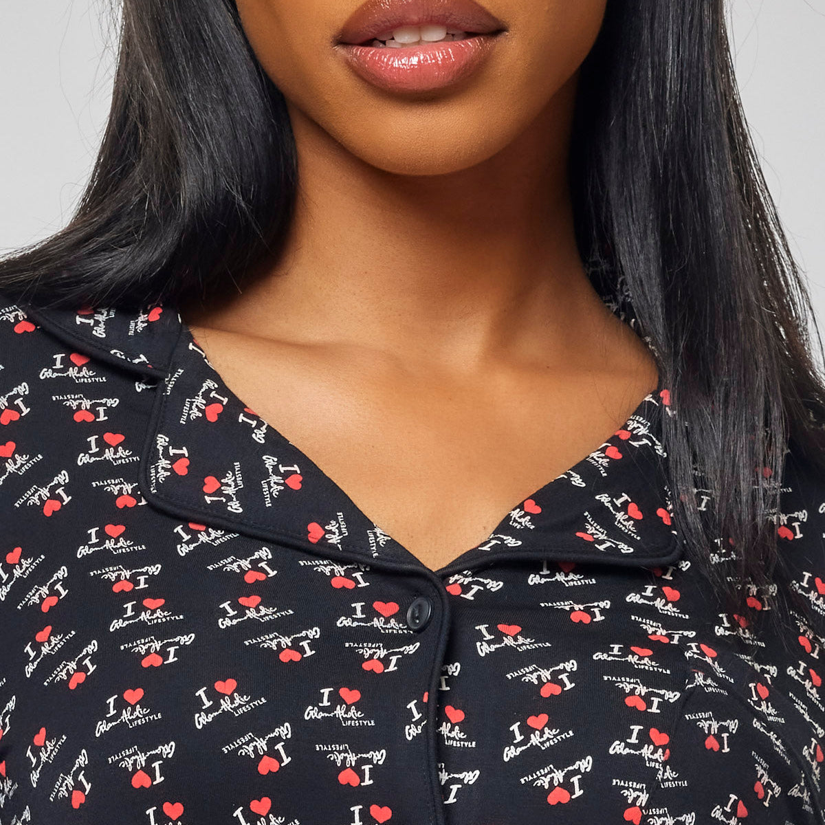 Black long pajamas featuring a playful "I Love Gal" print, perfect for stylish comfort at home.