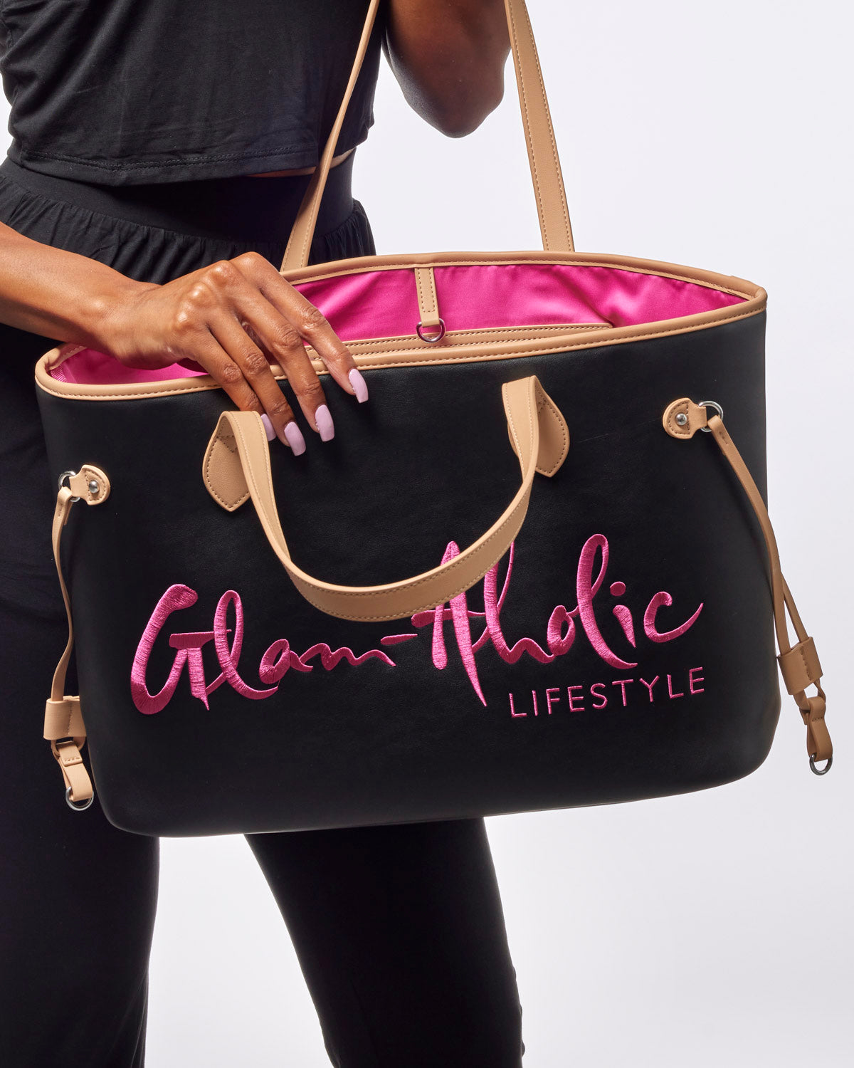 Stylish black tote bag with pink interior and Glam-Aholic Lifestyle logo, perfect for everyday use.