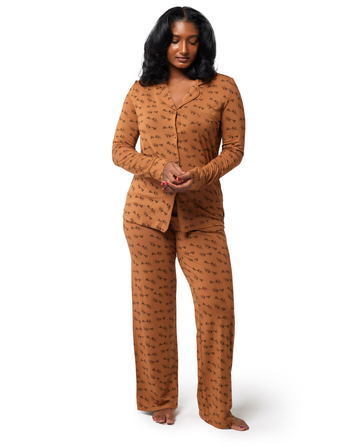 Brown signature pajamas set featuring a button-up top and matching pants, designed for comfort and style.